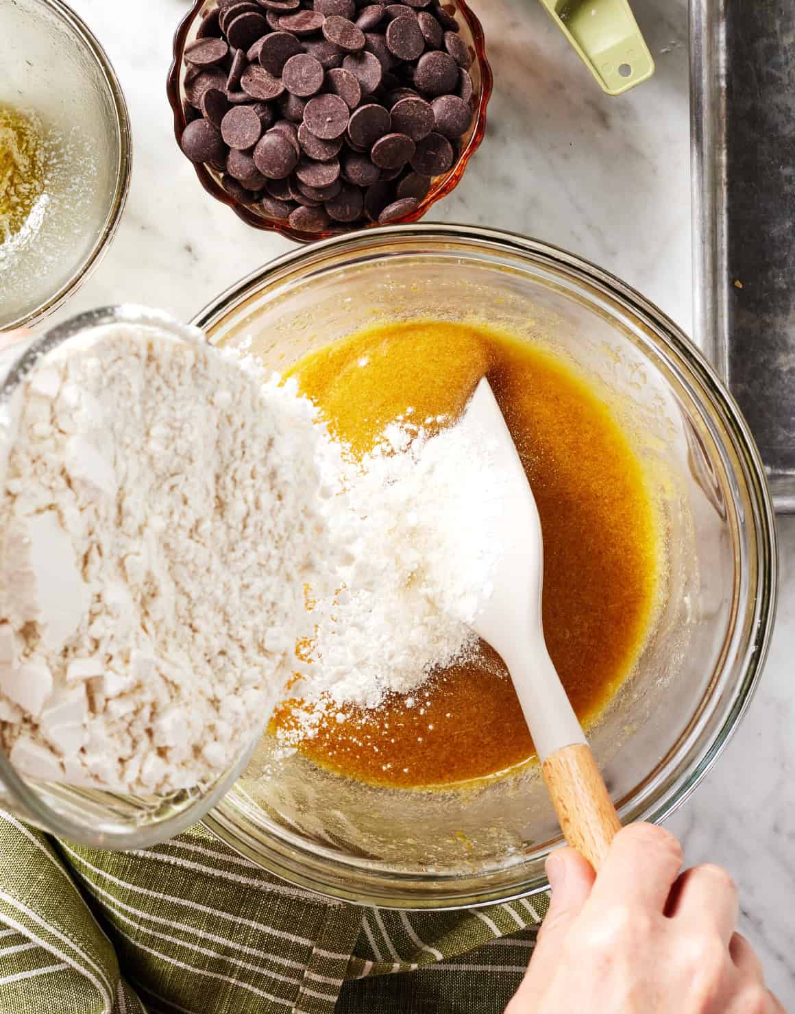 Adding dry ingredients to wet ingredients