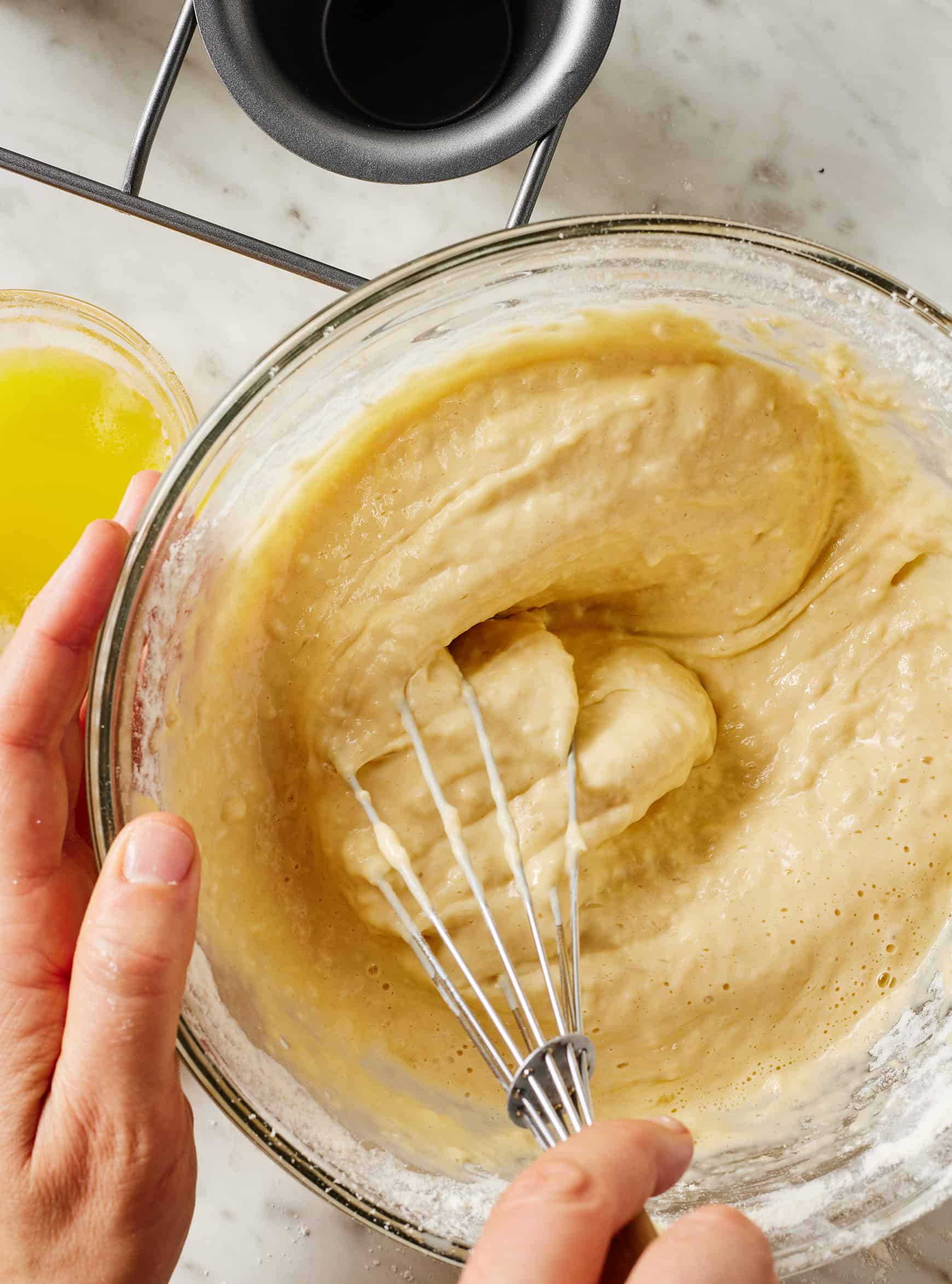 Whisking popover batter in glass bowl