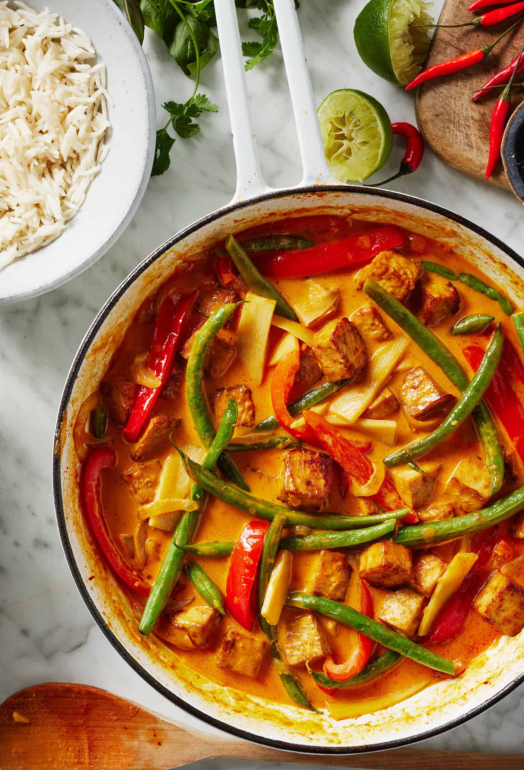 Red curry with tofu and vegetables in skillet