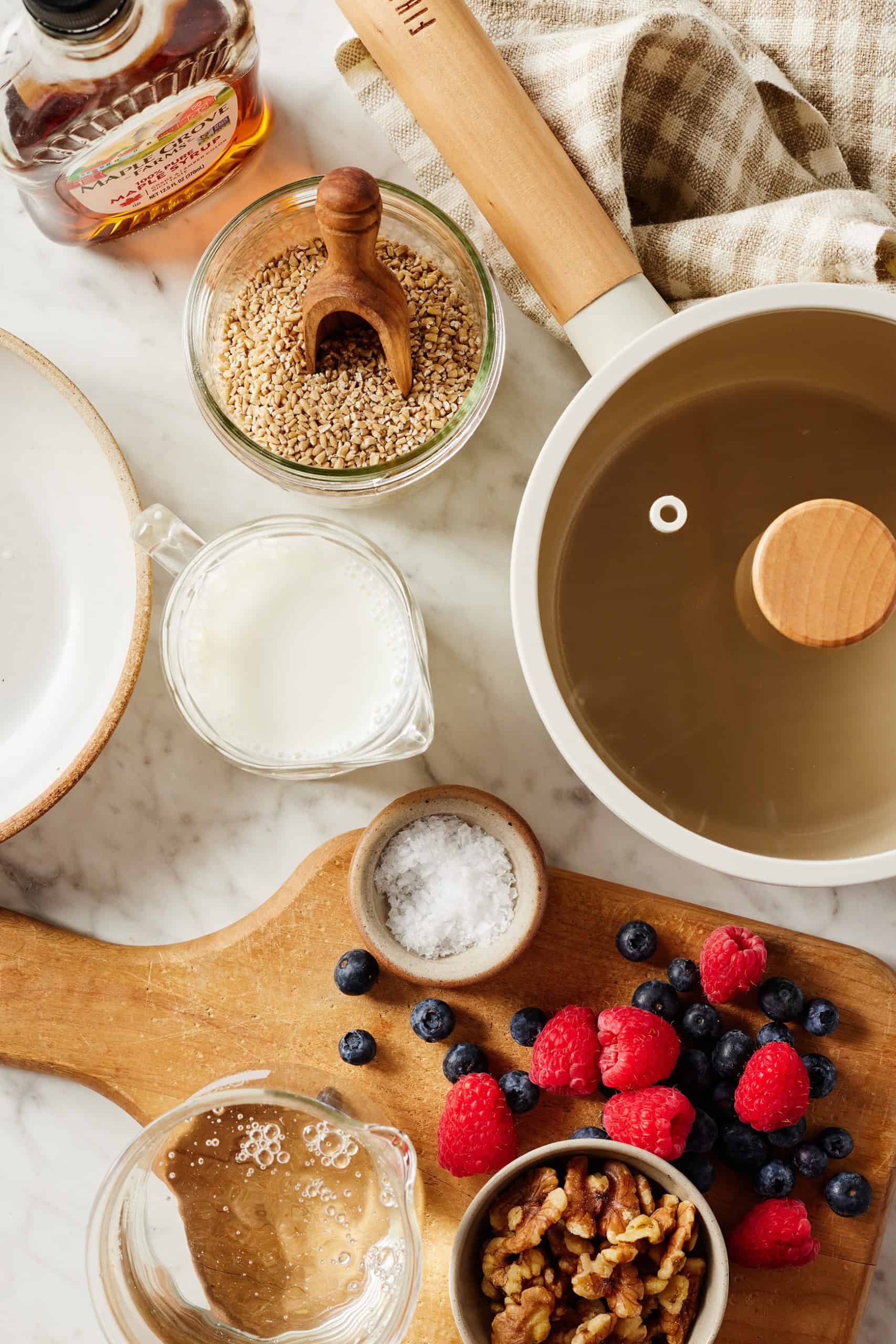 Recipe ingredients - Steel cut oats, milk, water, maple syrup, fresh berries, and walnuts
