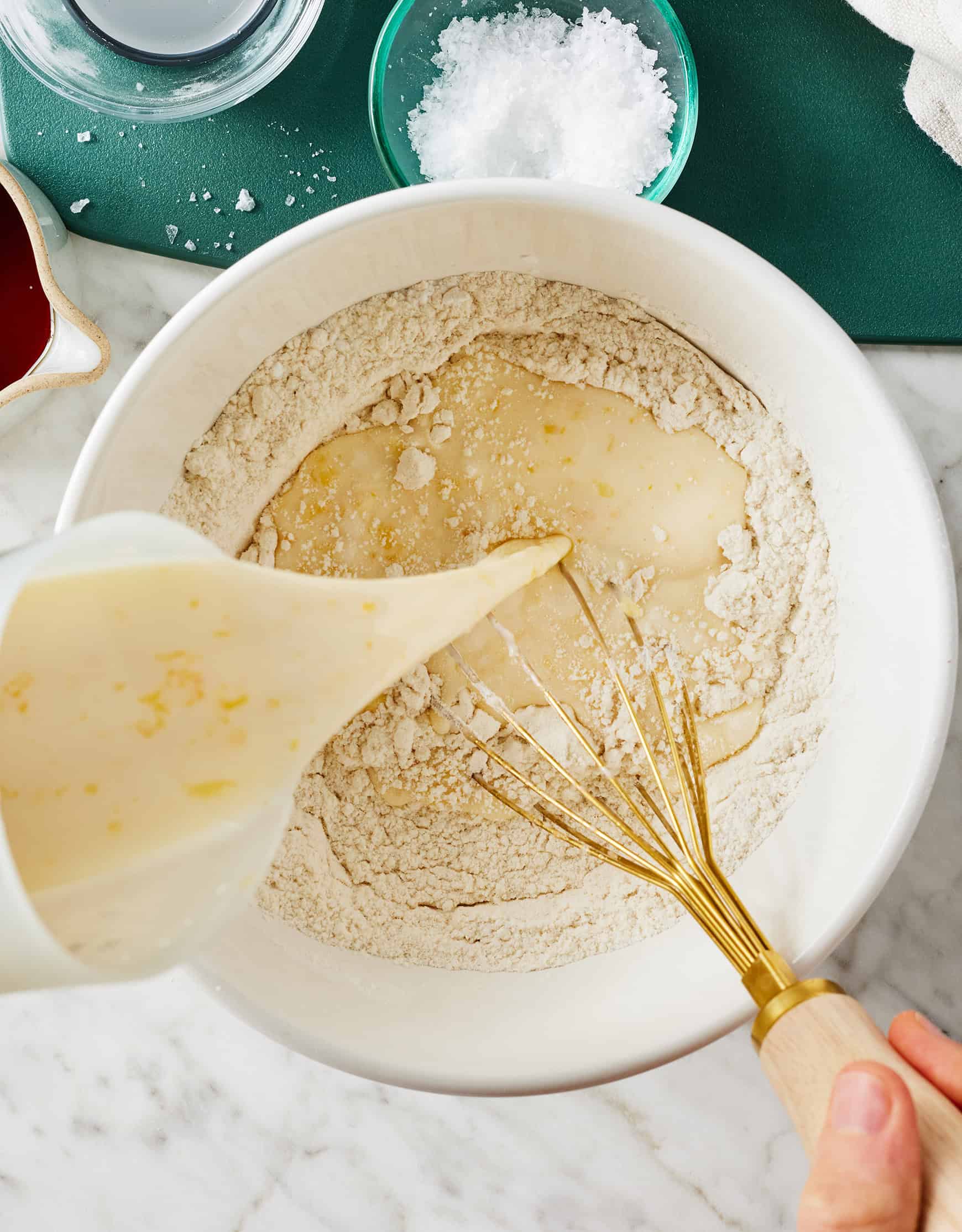 Pouring wet ingredients into dry ingredients
