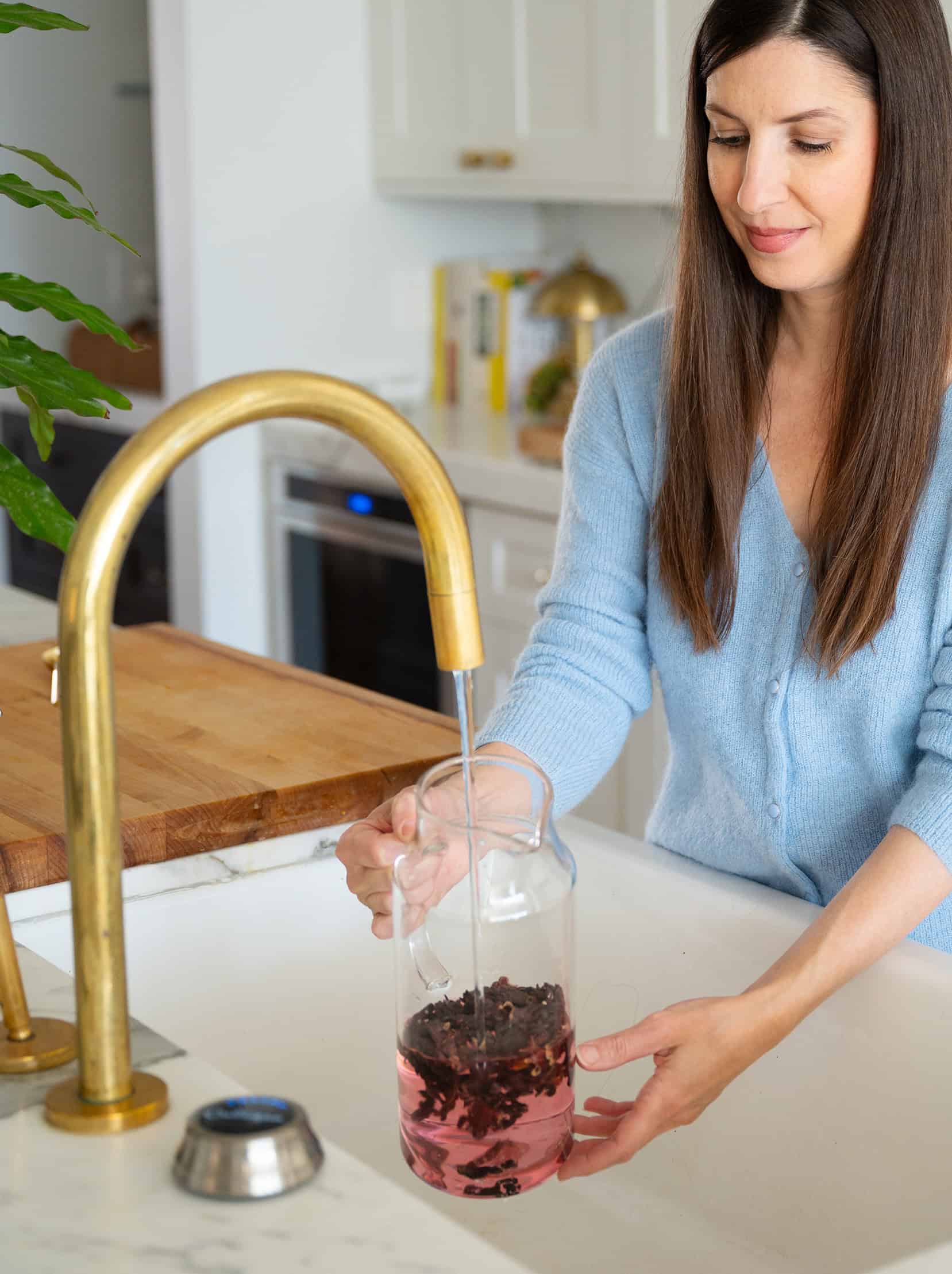 Filling pitcher with filtered water from kitchen tap
