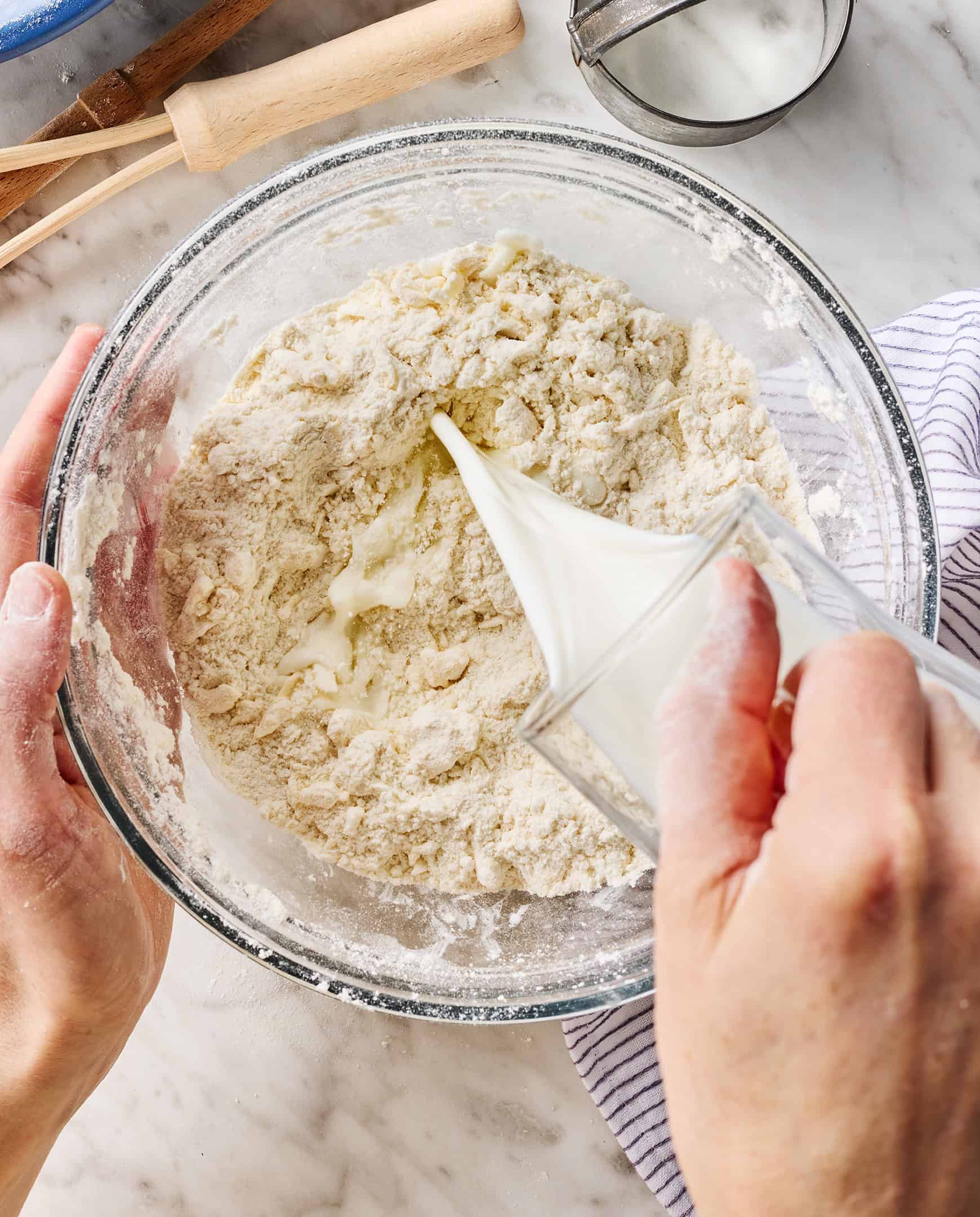 Pouring milk into flour mixture