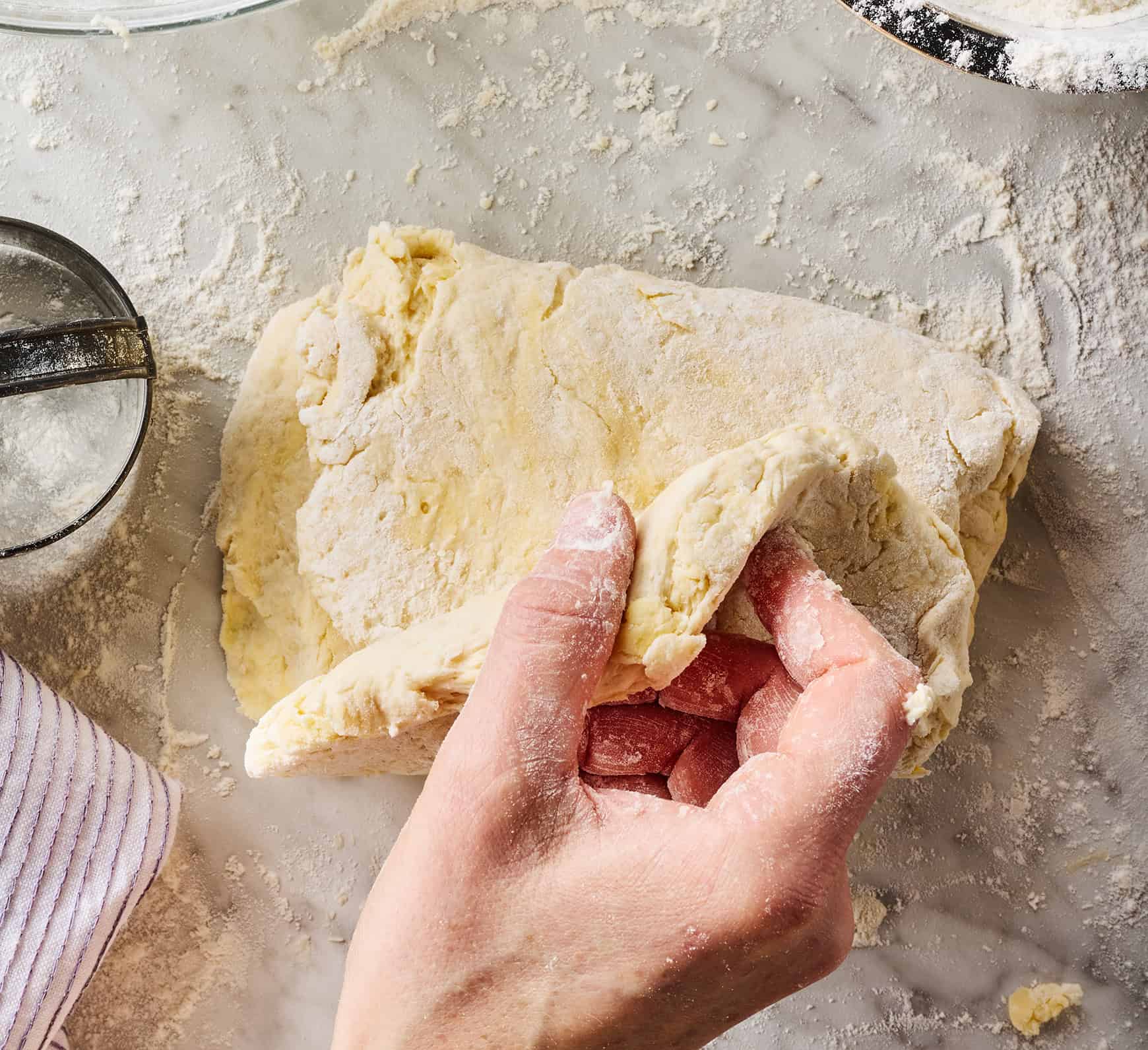 Folding dough into thirds to create layers