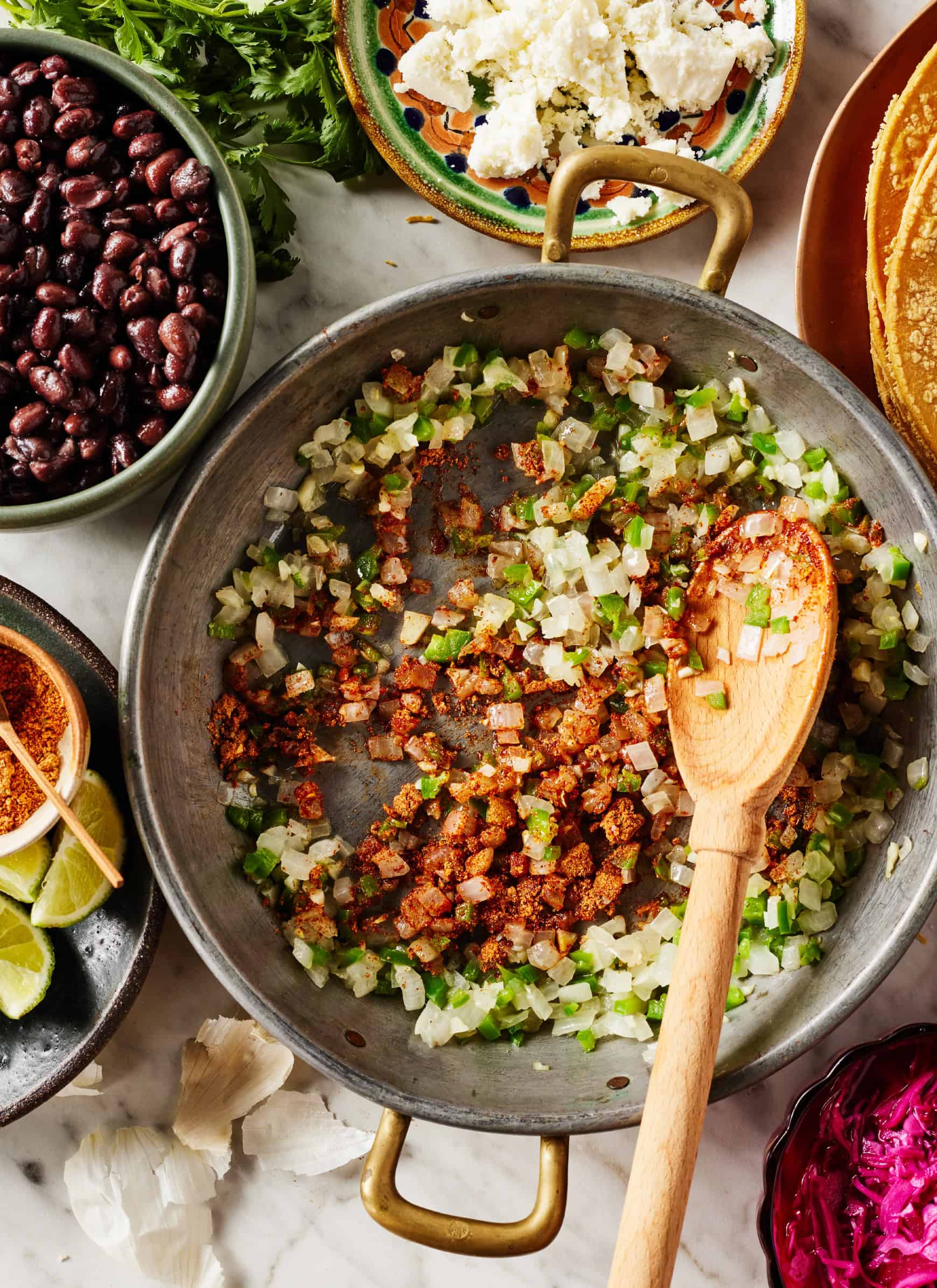 Sautéing onion and jalapeno with spices