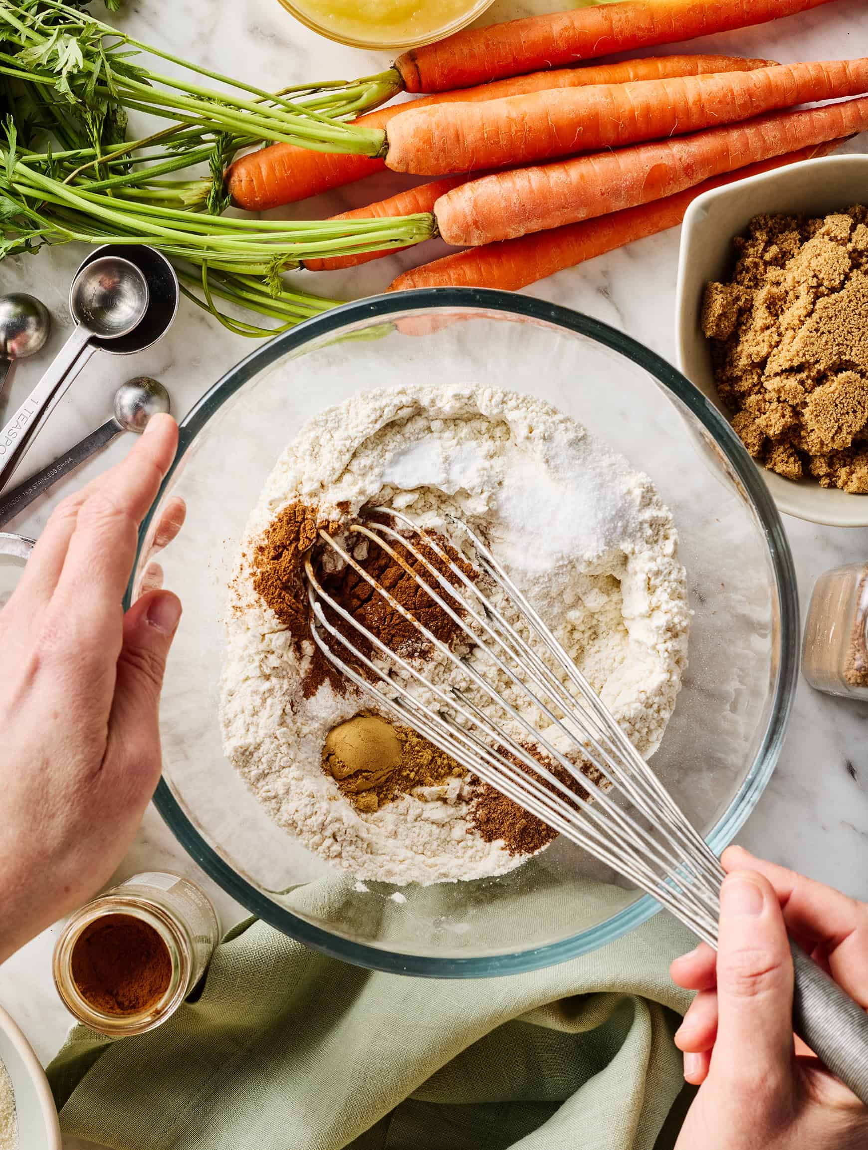 Whisking dry ingredients in glass mixing bowl