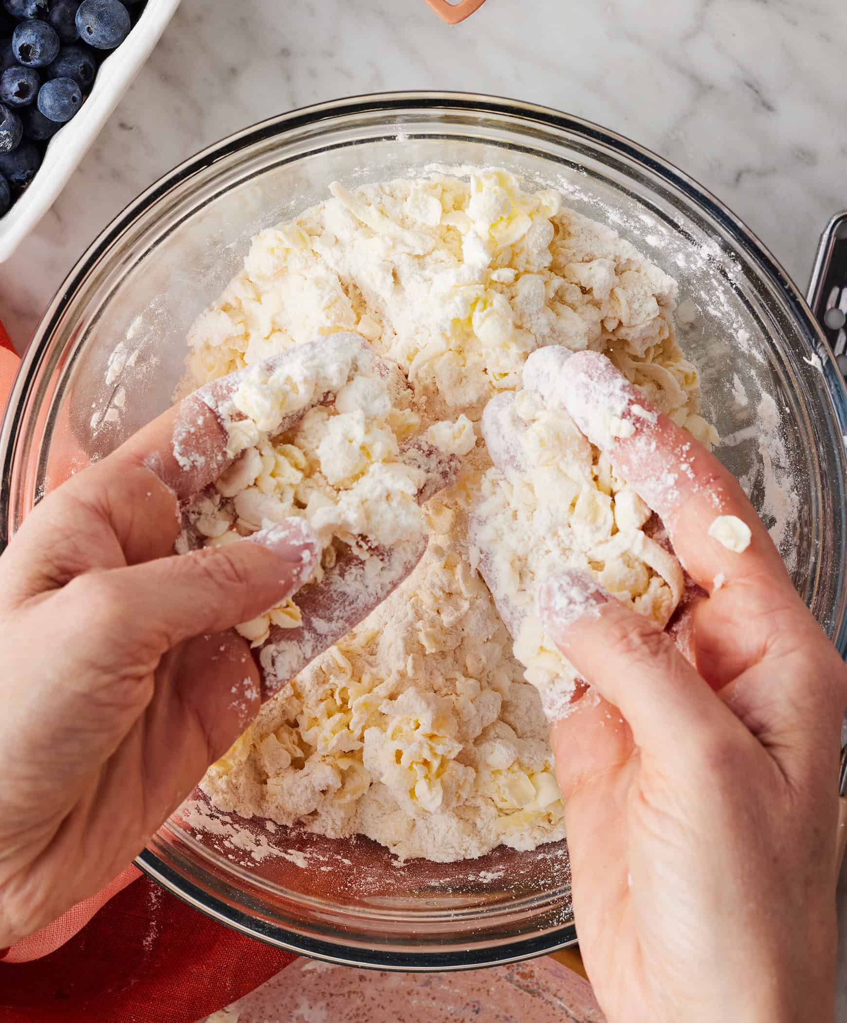 How to make scones - working grated butter into flour mixture