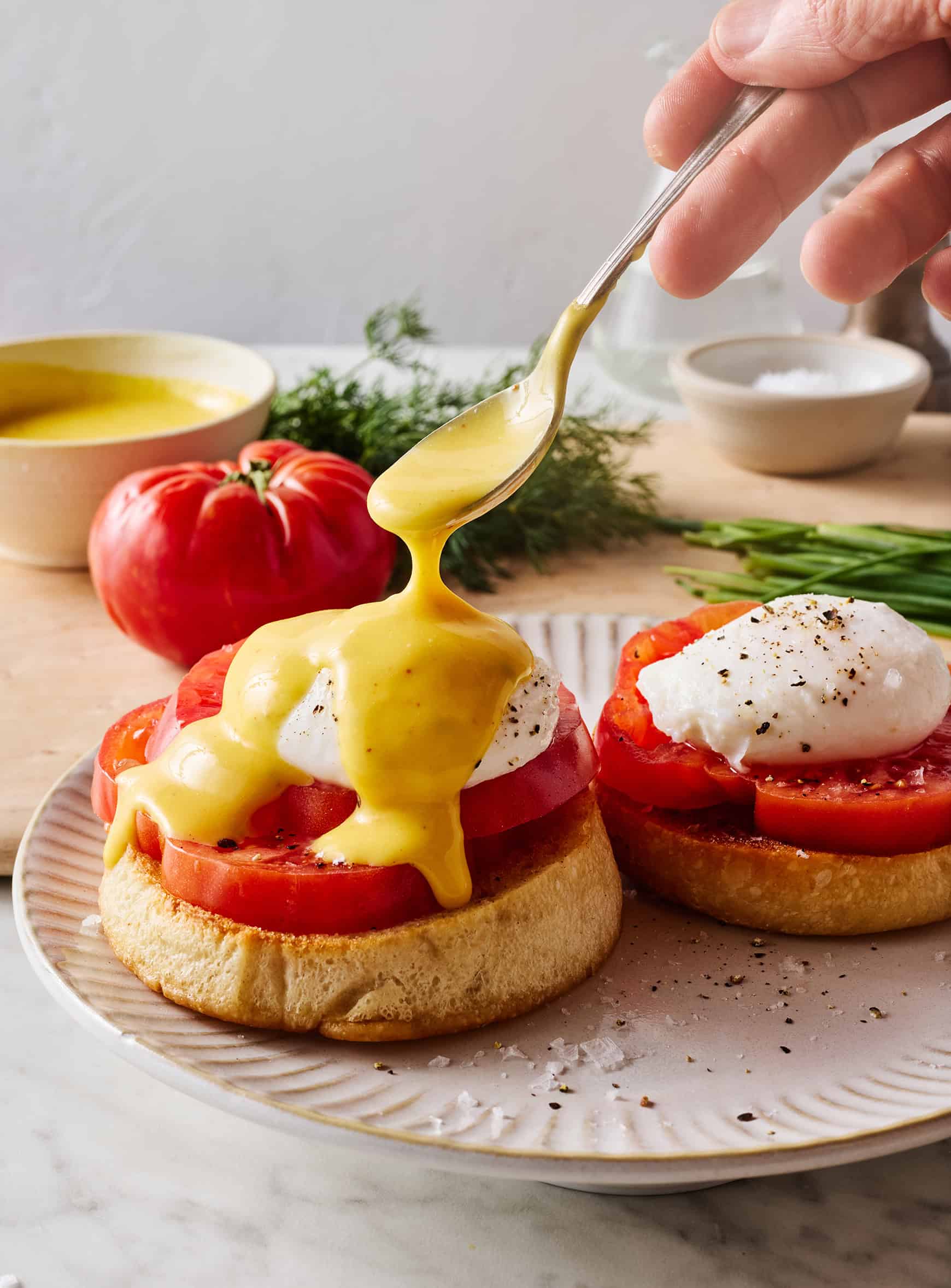 Assembling eggs Benedict