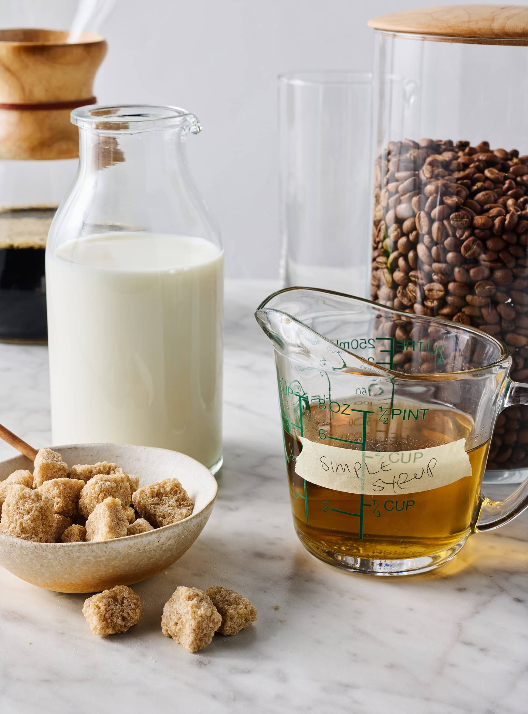 Recipe ingredients - Coffee, milk, simple syrup, and sugar cubes