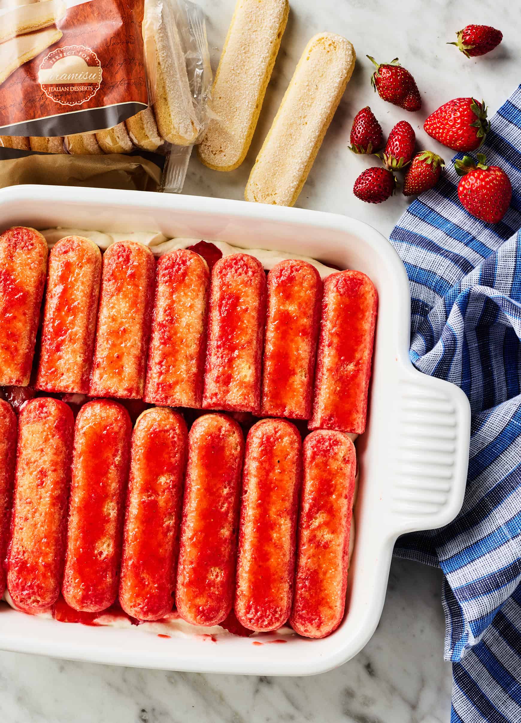 Second layer of ladyfingers in strawberry tiramisu