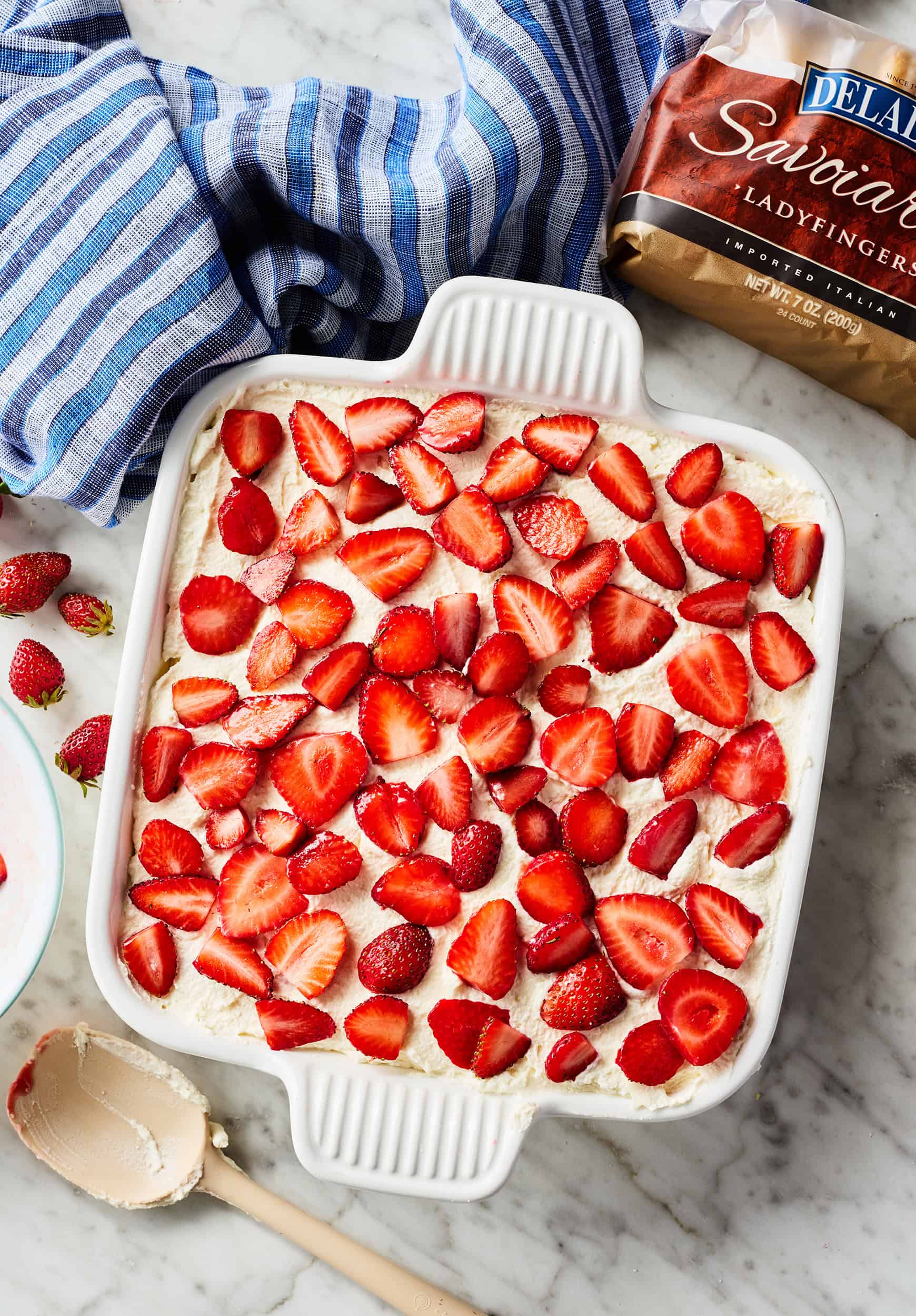 Fully assembled strawberry tiramisu in baking dish