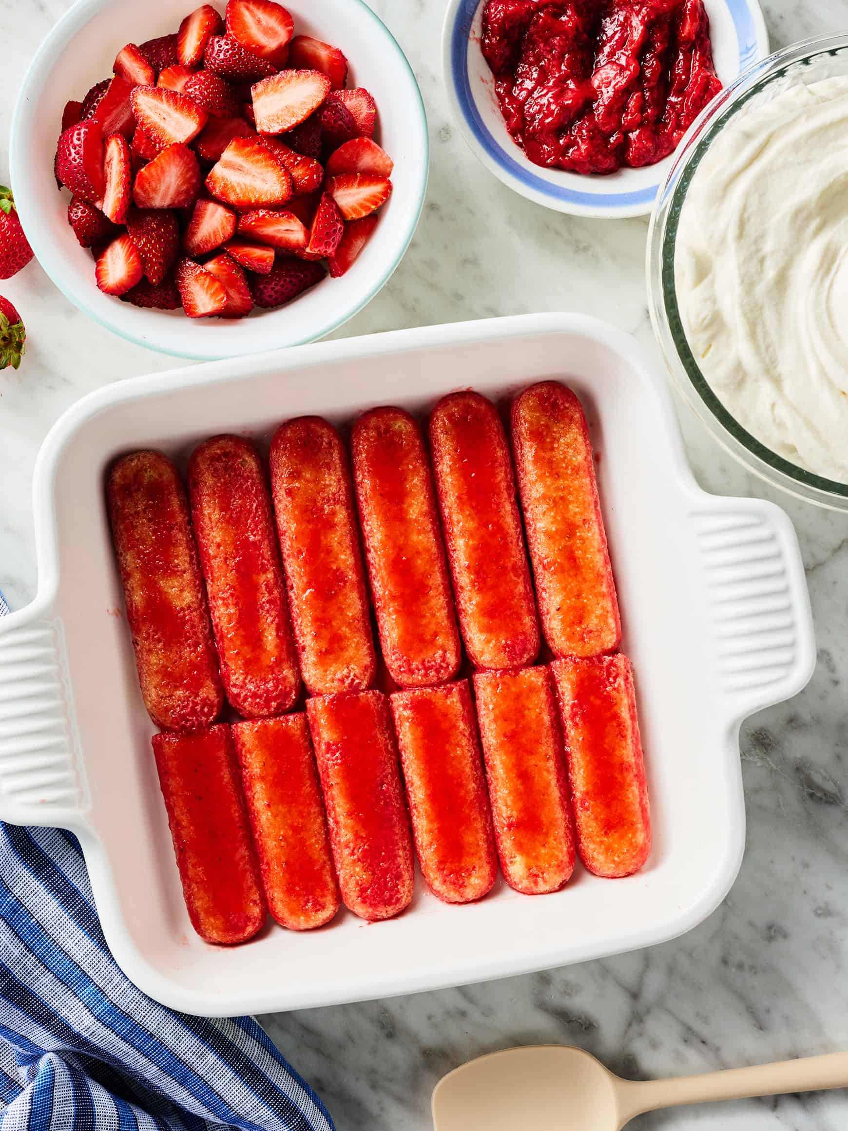 Dipped ladyfingers in baking dish