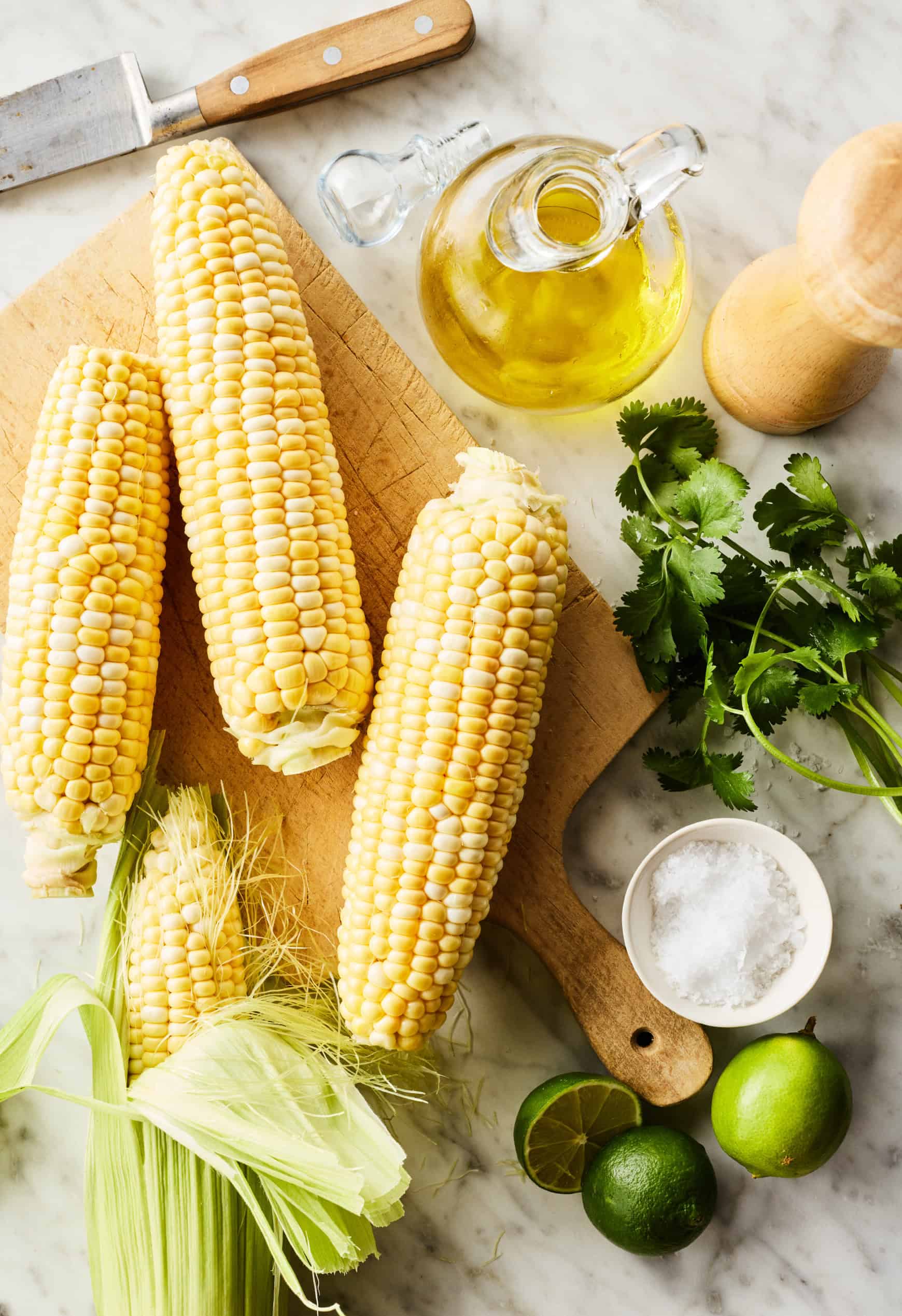 Recipe ingredients - fresh corn, oil, salt, lime, and cilantro