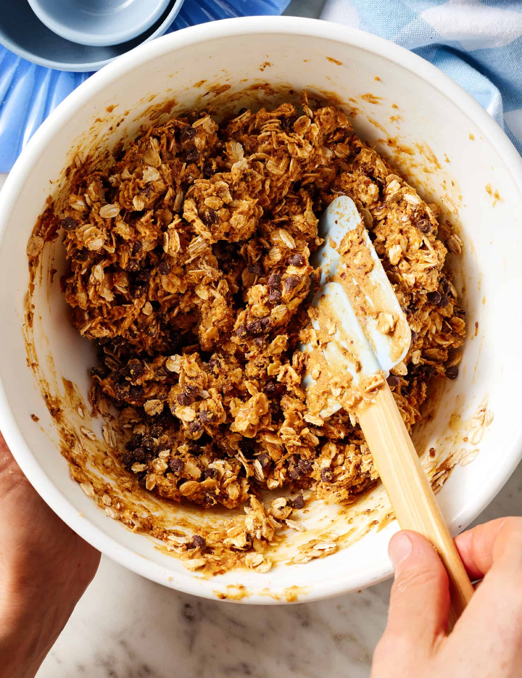 Peanut butter and oat mixture in mixing bowl