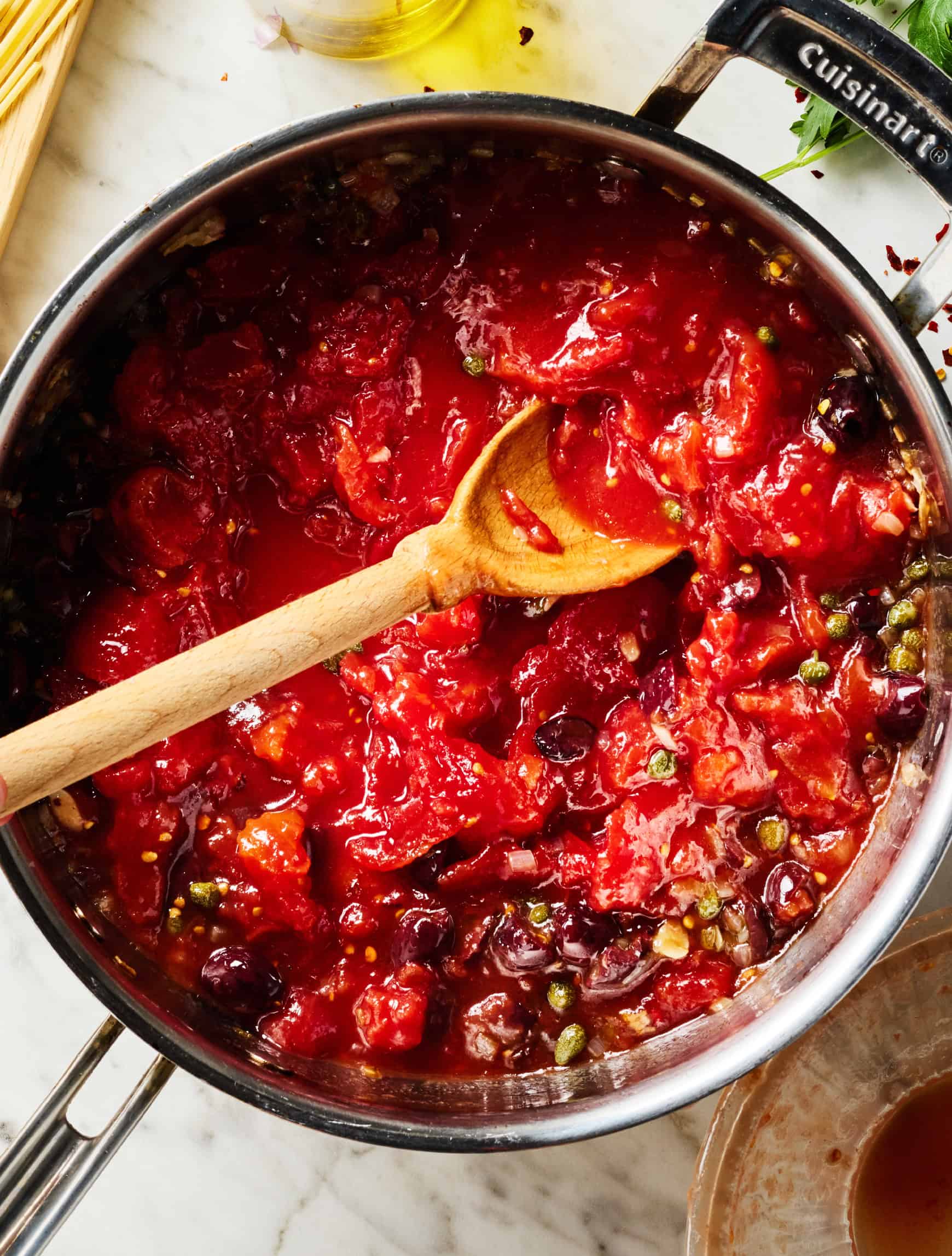 Tomato, caper, and olive mixture in skillet