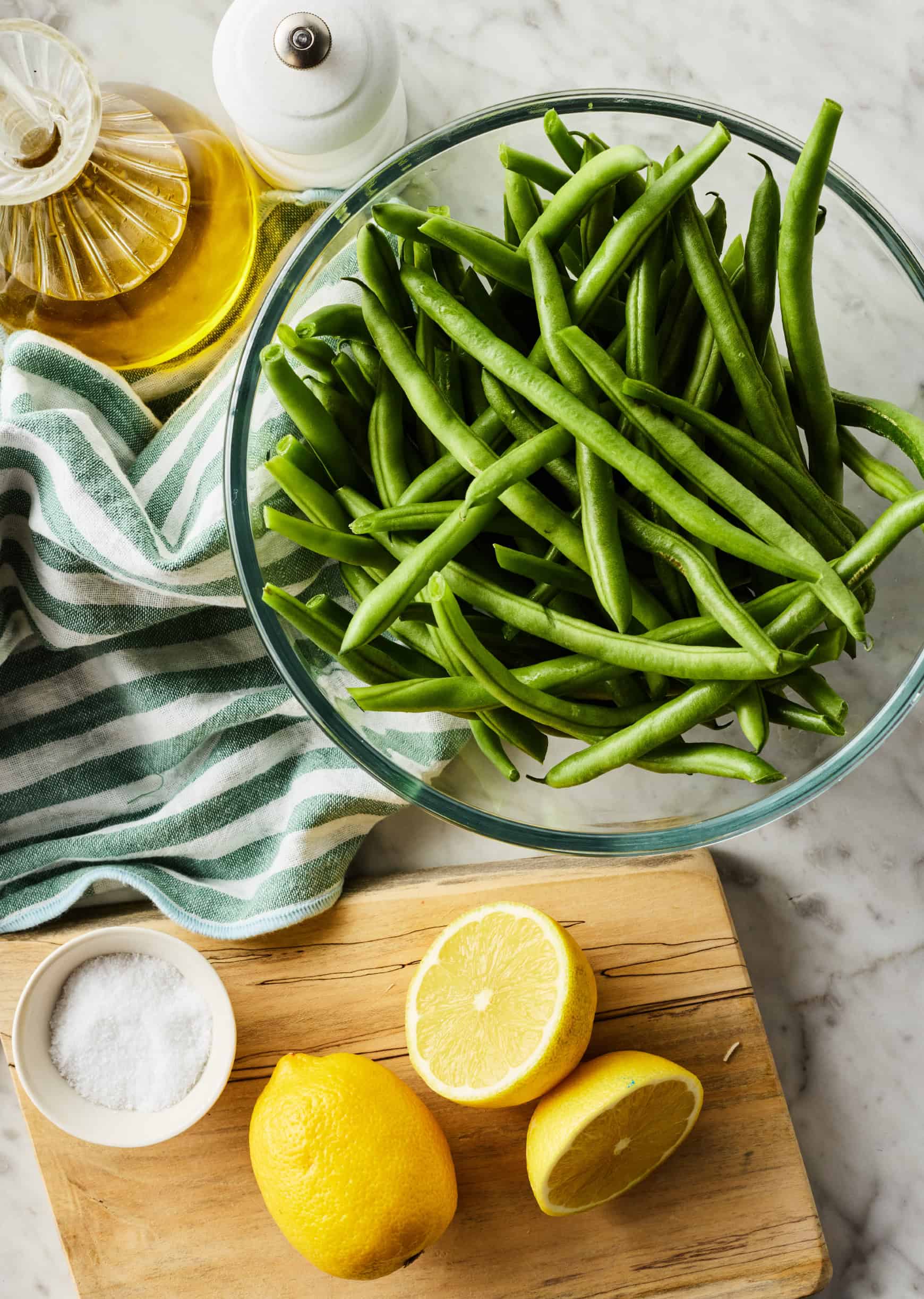 recipe ingredients - green beans, olive oil, salt, pepper, and lemons