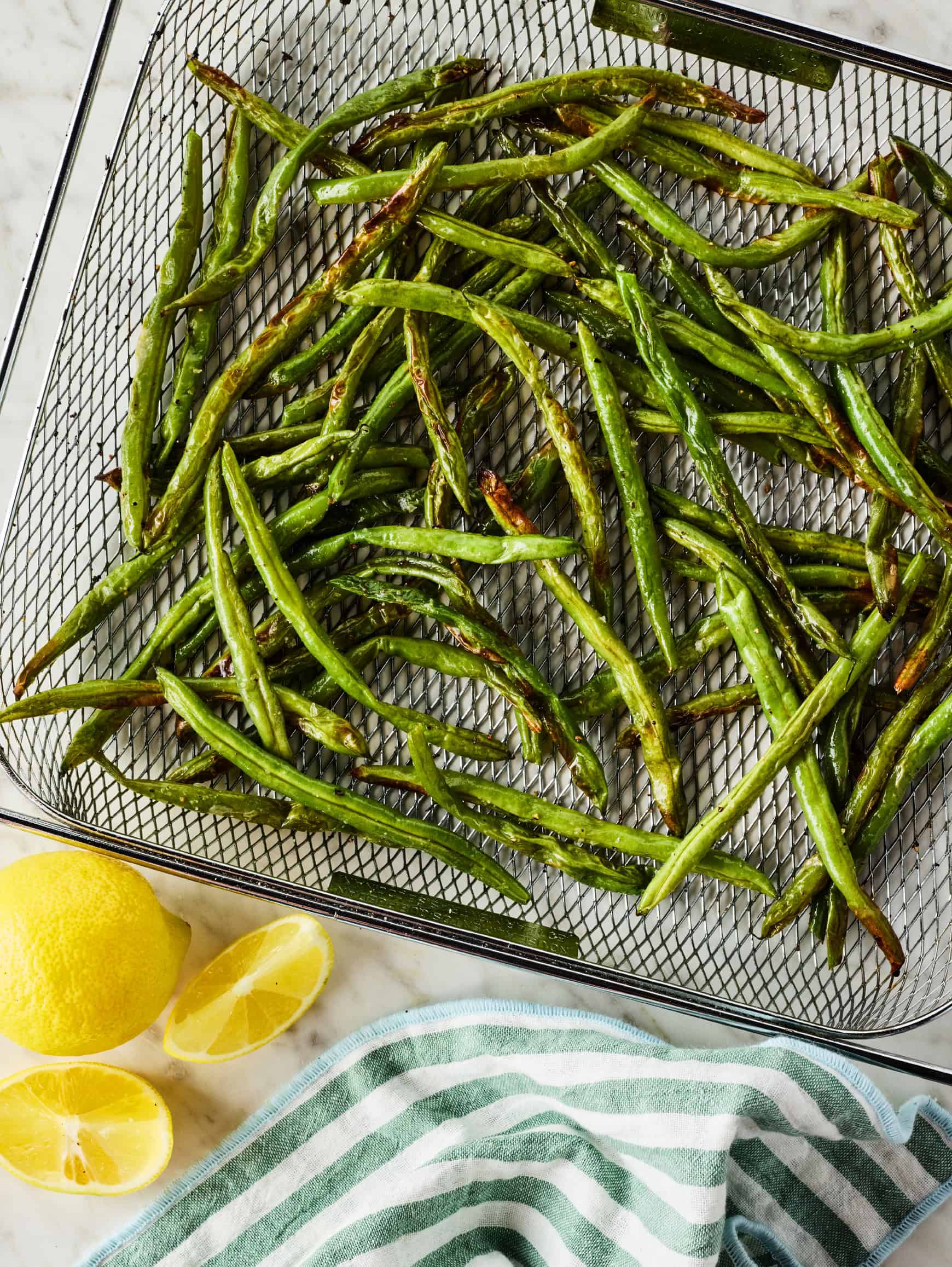 Green beans in air fryer basket