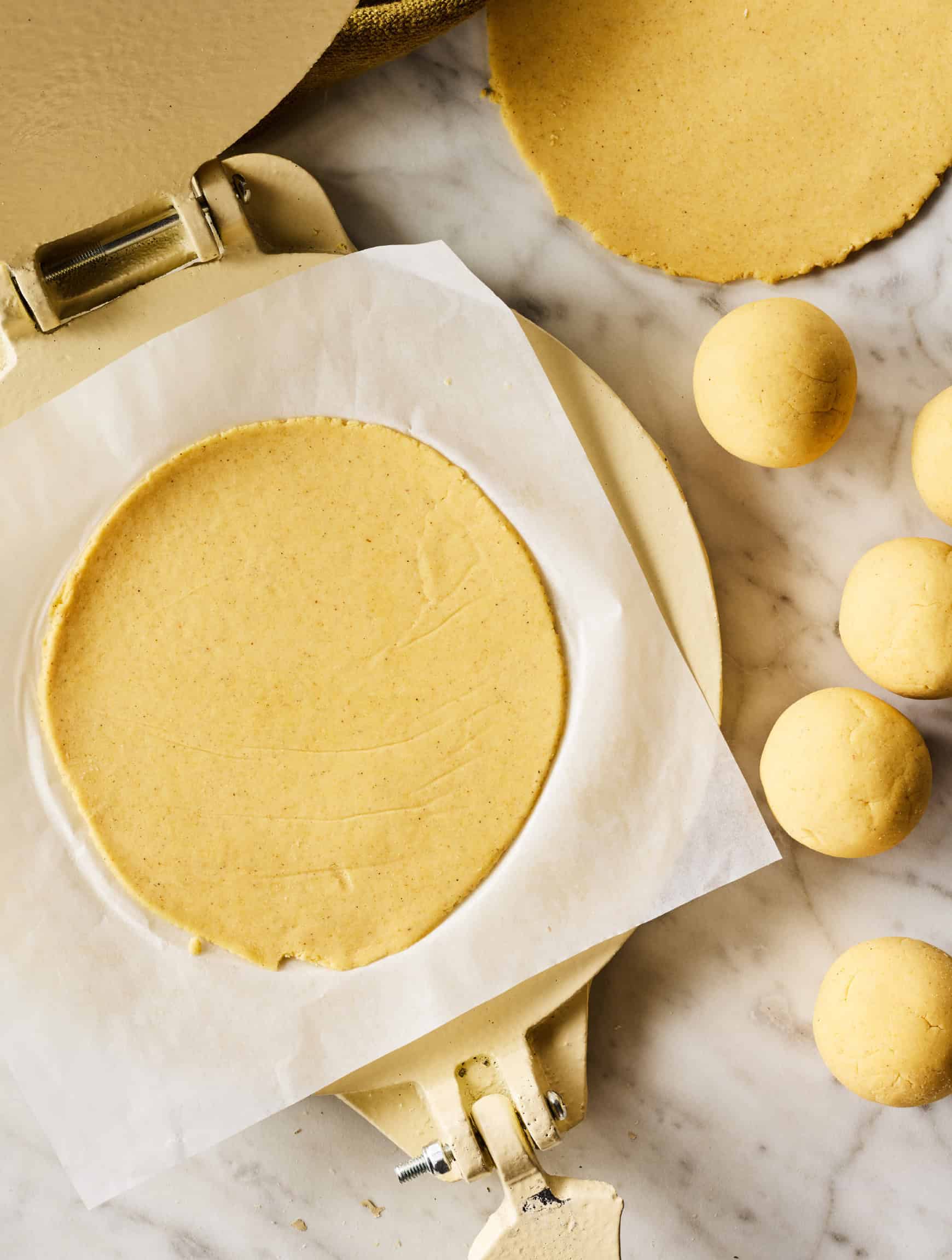 Corn tortilla in tortilla press