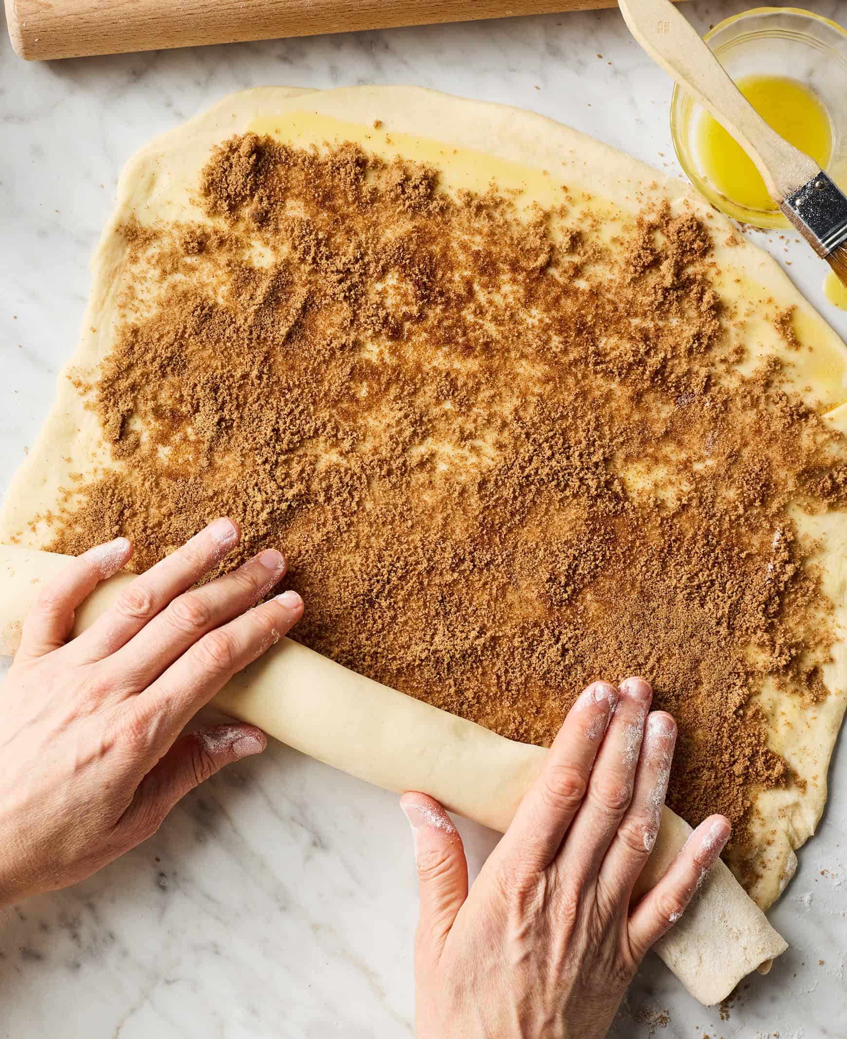 Rolling filled dough into a log