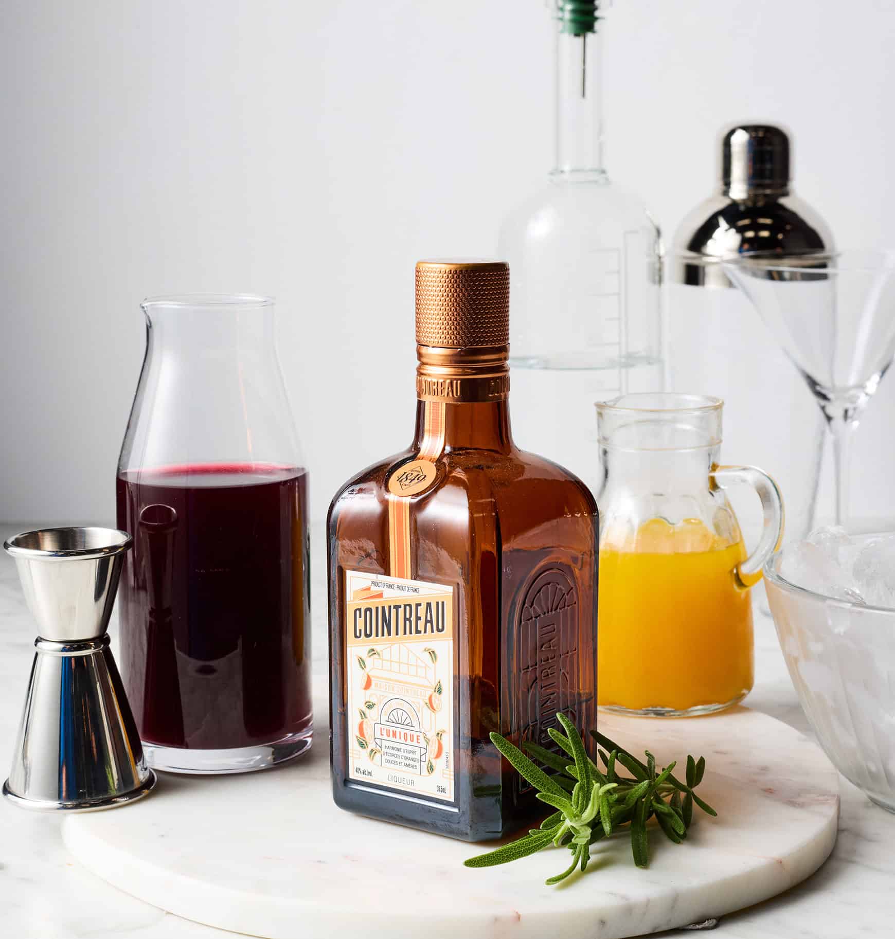 Pomegranate juice, cointreau, orange juice, and vodka