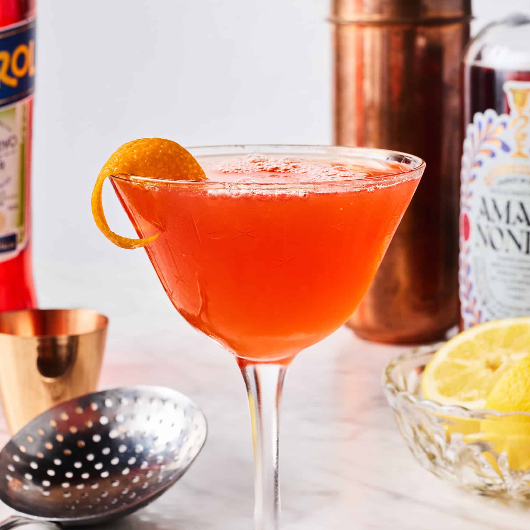 Paper plane drink with orange twist