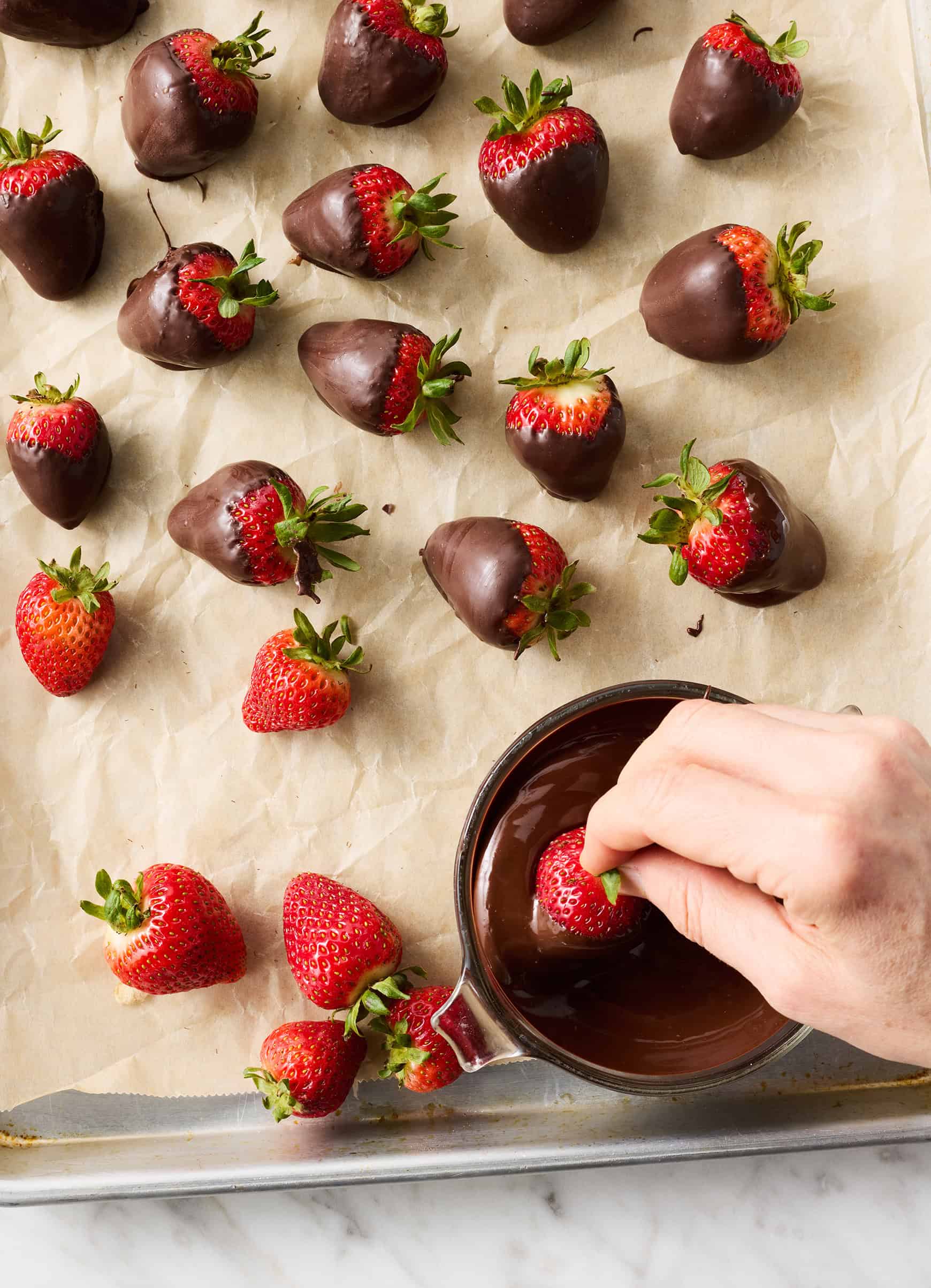 How to make chocolate covered strawberries - Dipping strawberry in melted chocolate
