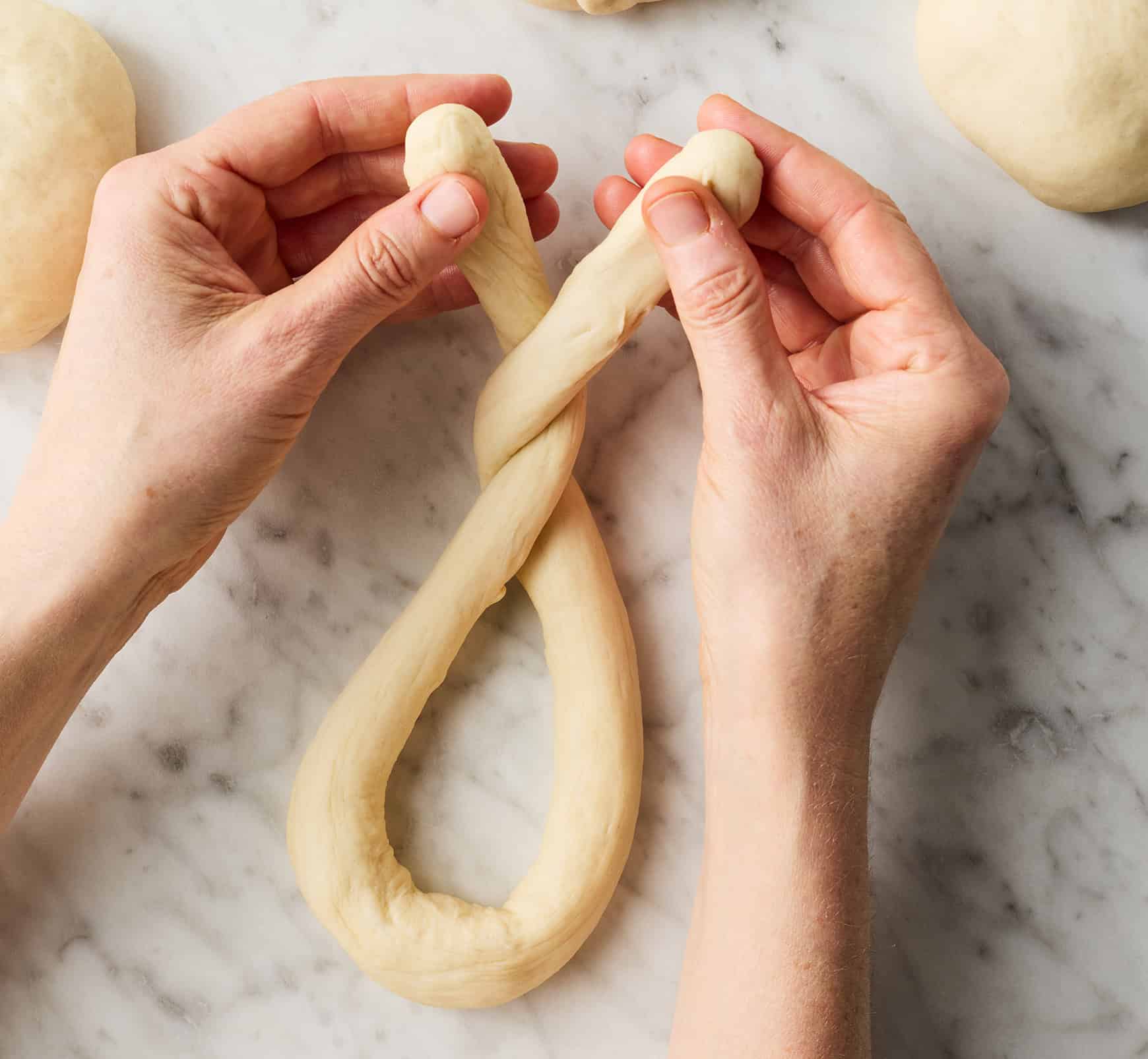 Twisting ends of dough rope together