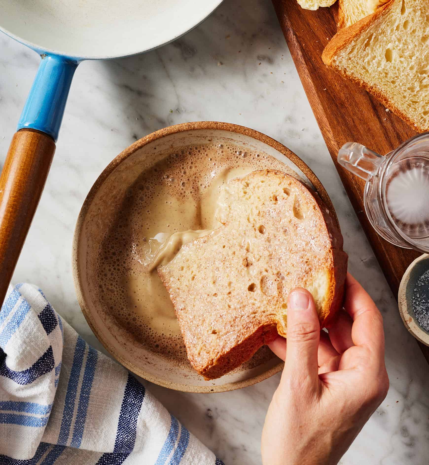 Dipping bread slice in cornstarch batter