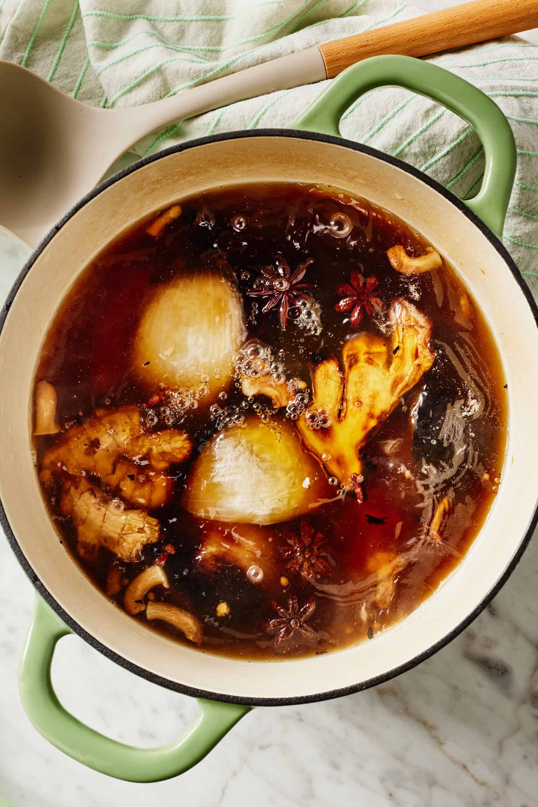 Pho broth simmering in large pot