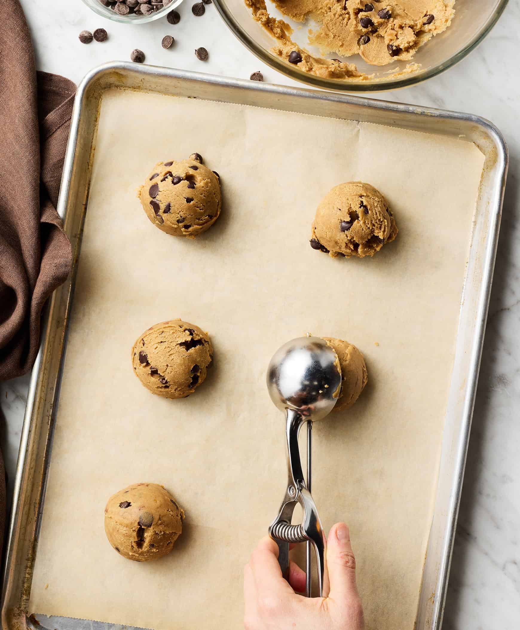 Scooping cookie dough onto baking sheet