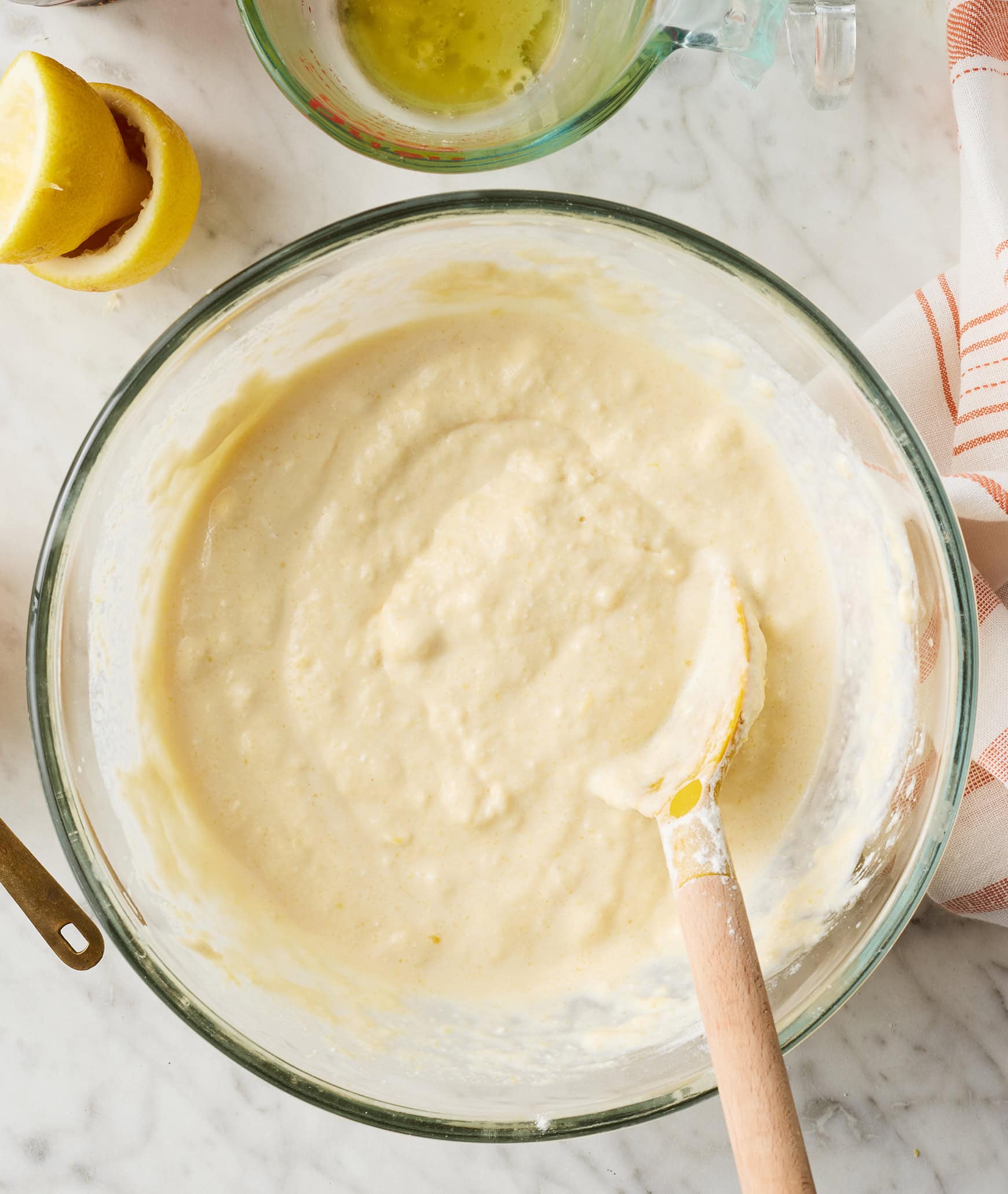 Pancake batter in bowl with wooden spoon