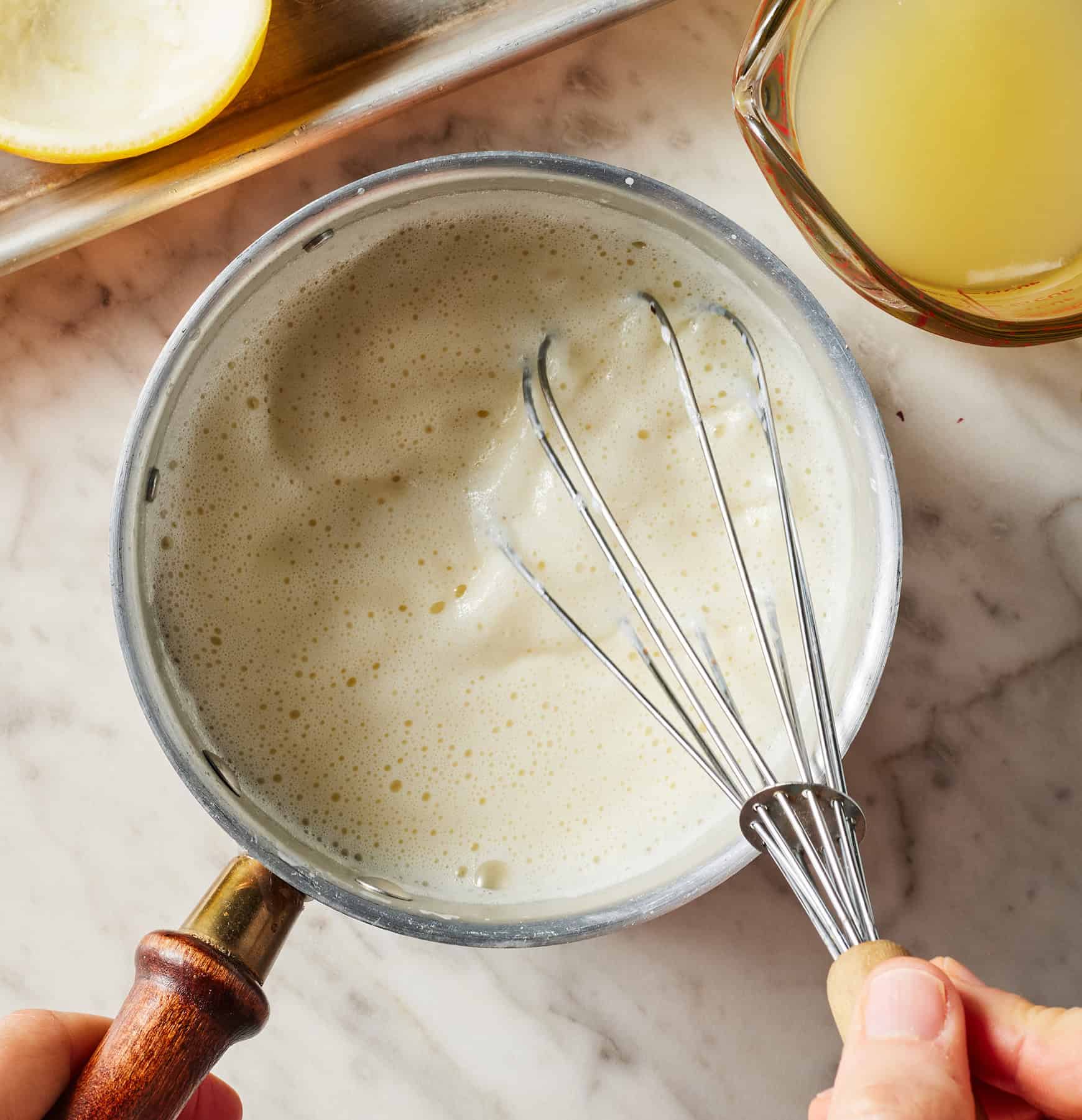 Whisking cream in saucepan
