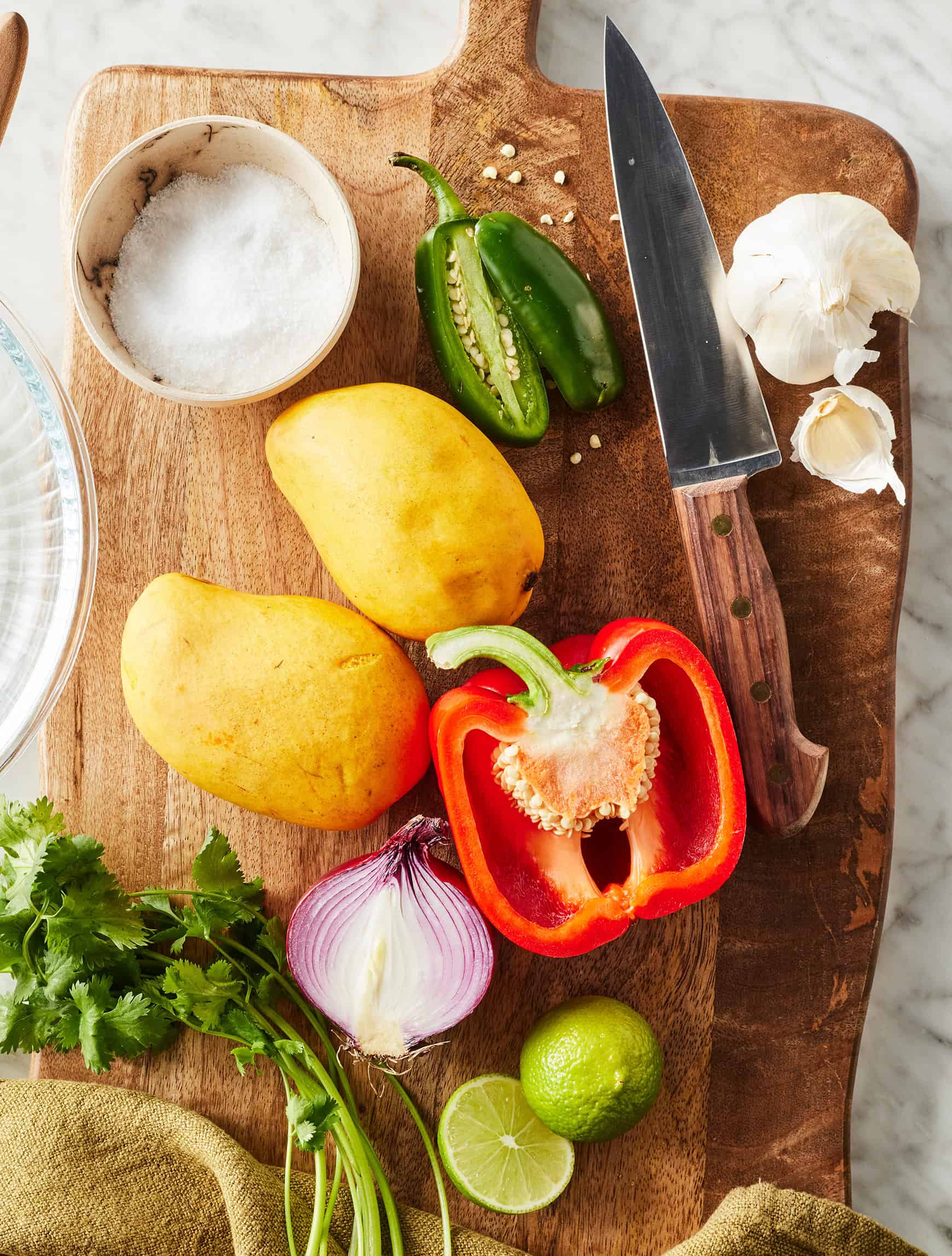 Mango salsa recipe ingredients on cutting board