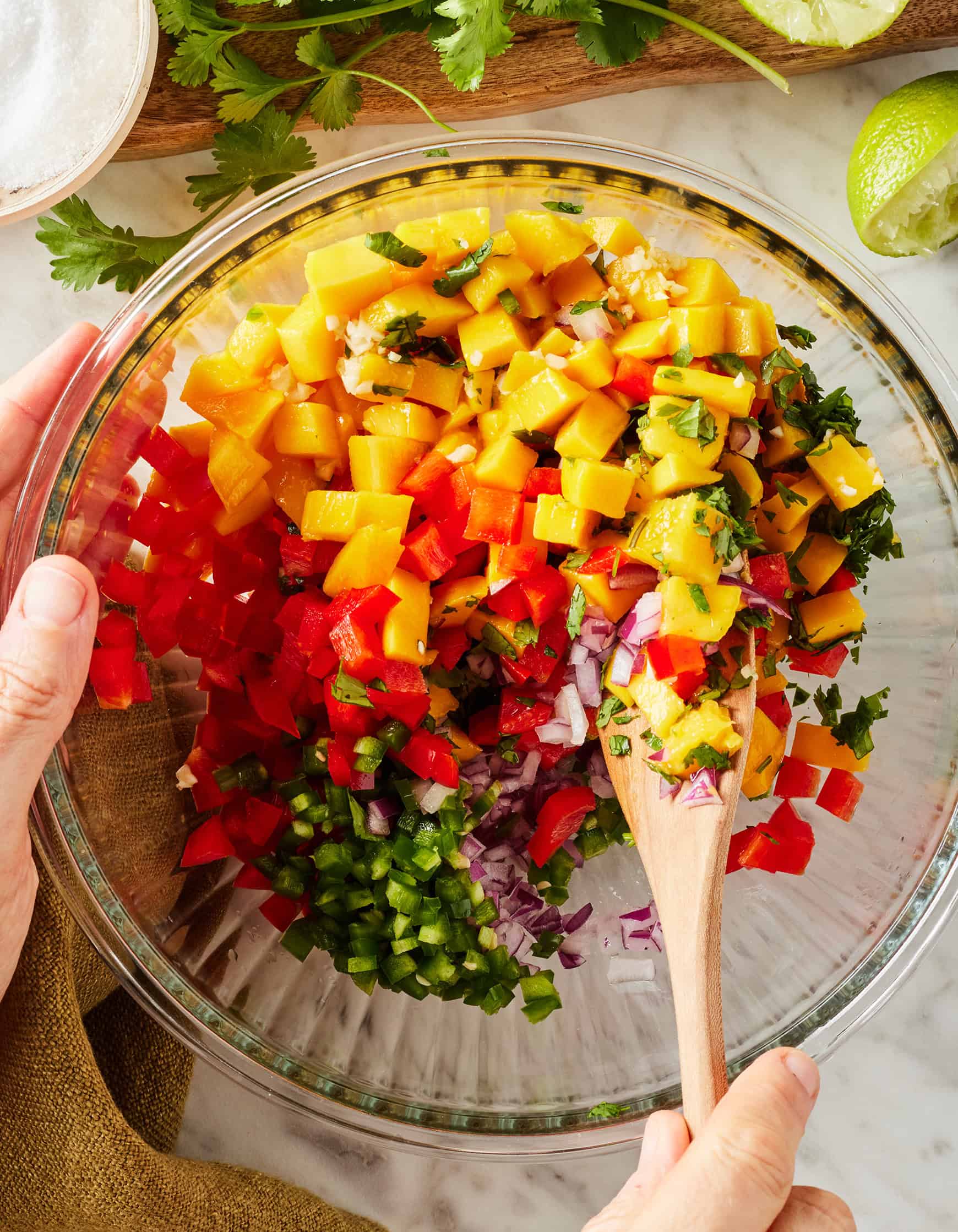 Mixing fresh ingredients together in glass bowl