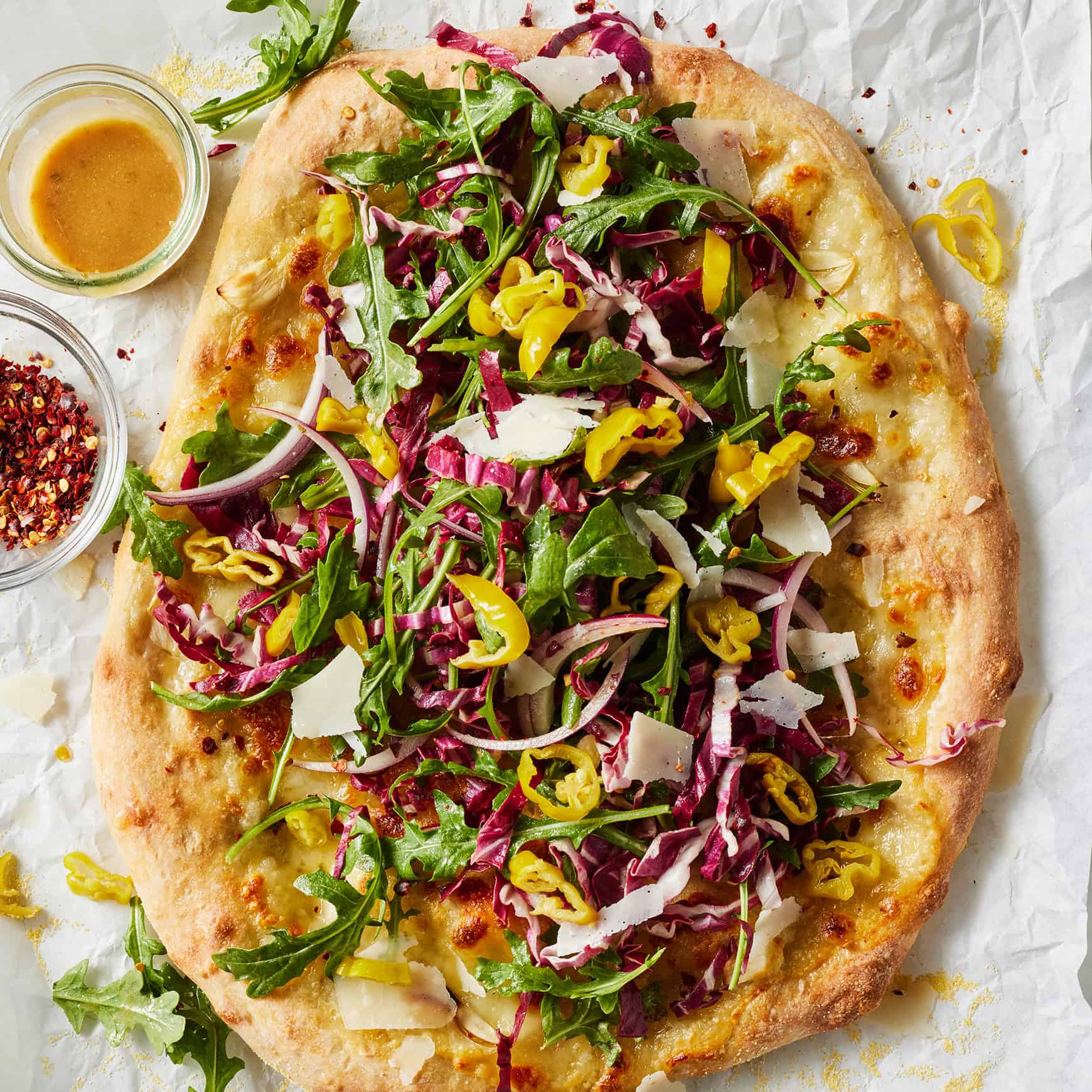 Salad pizza recipe topped with chopped Italian salad and pepperoncini