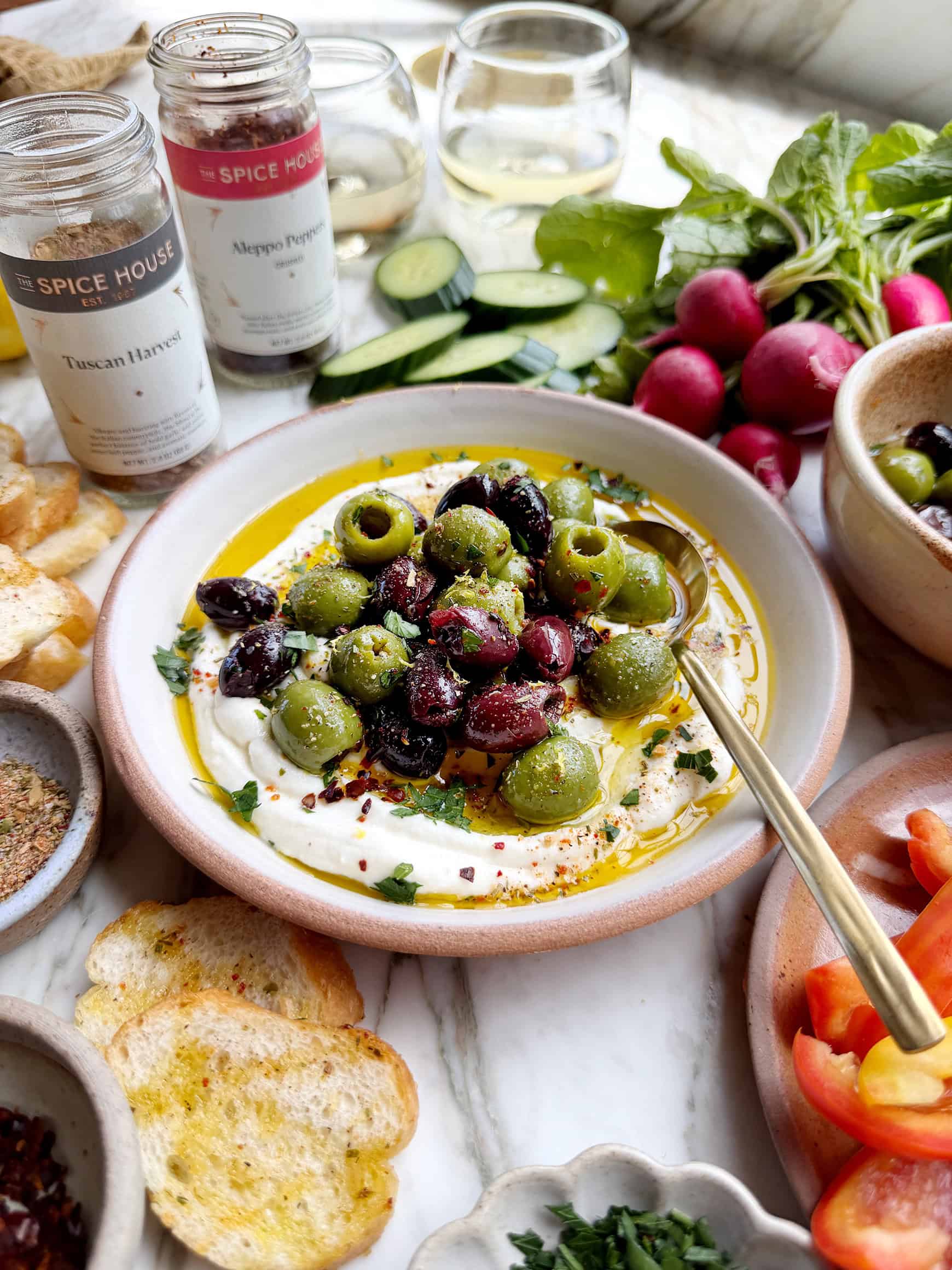Marinated olives over whipped ricotta
