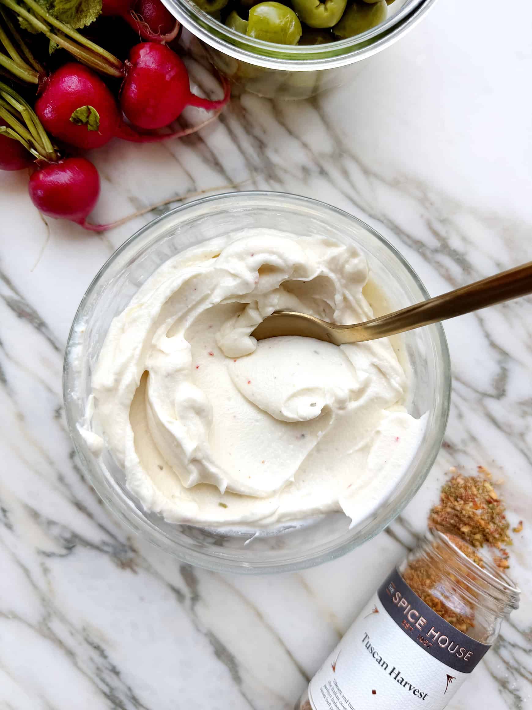 Whipped ricotta in bowl with spoon