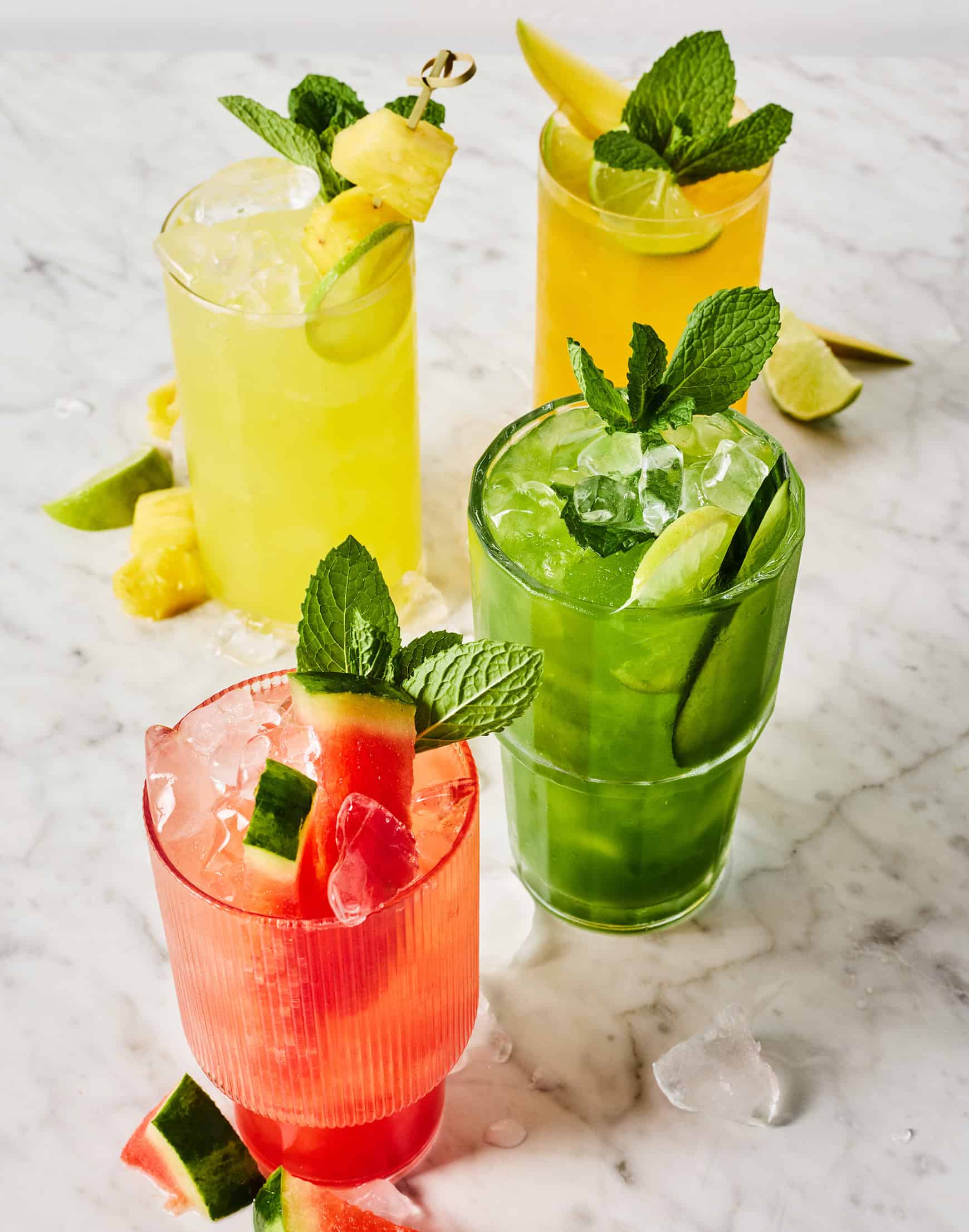 Four aguas frescas on marble countertop