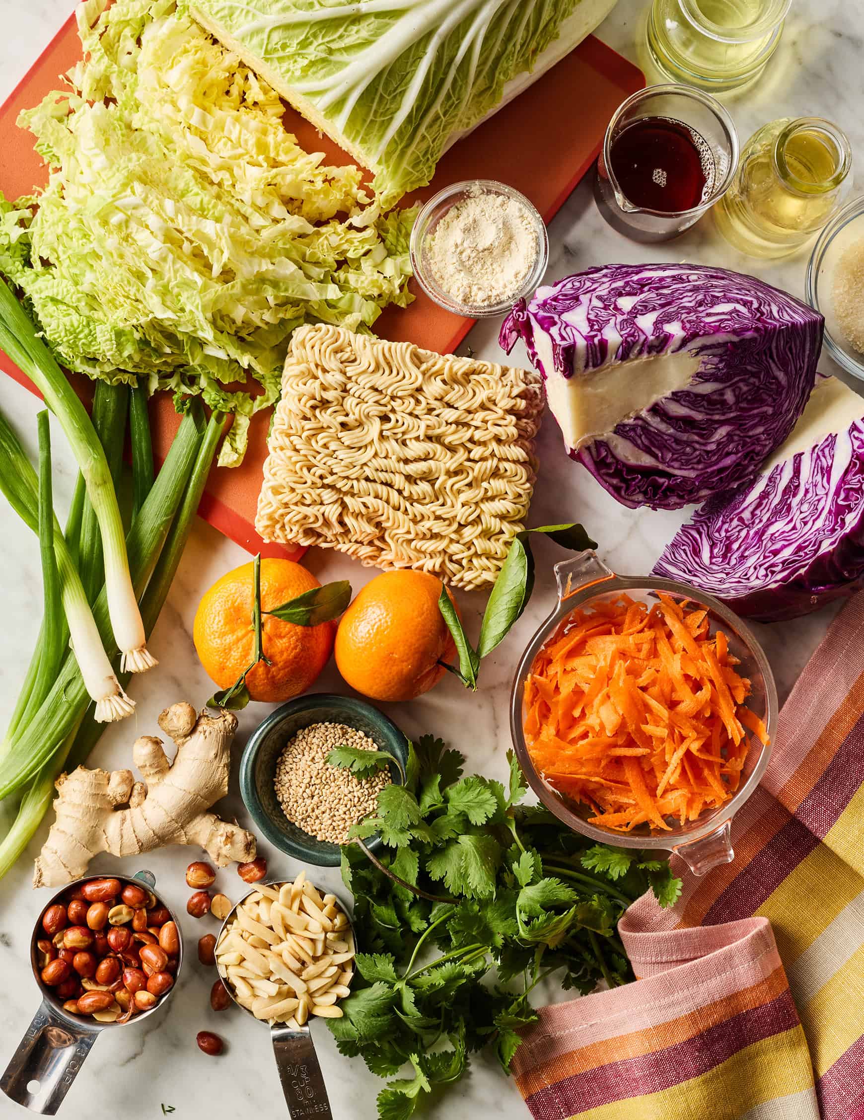 Ramen noodle salad recipe ingredients on marble countertop