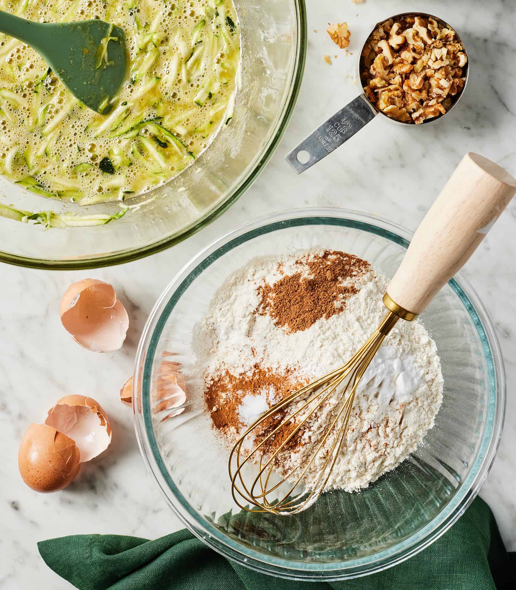 Dry and wet ingredients in two glass mixing bowls