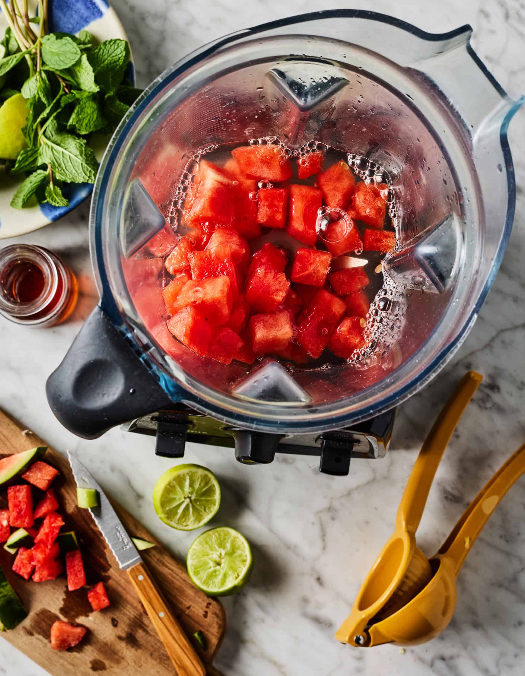 Cubed watermelon and water in blender