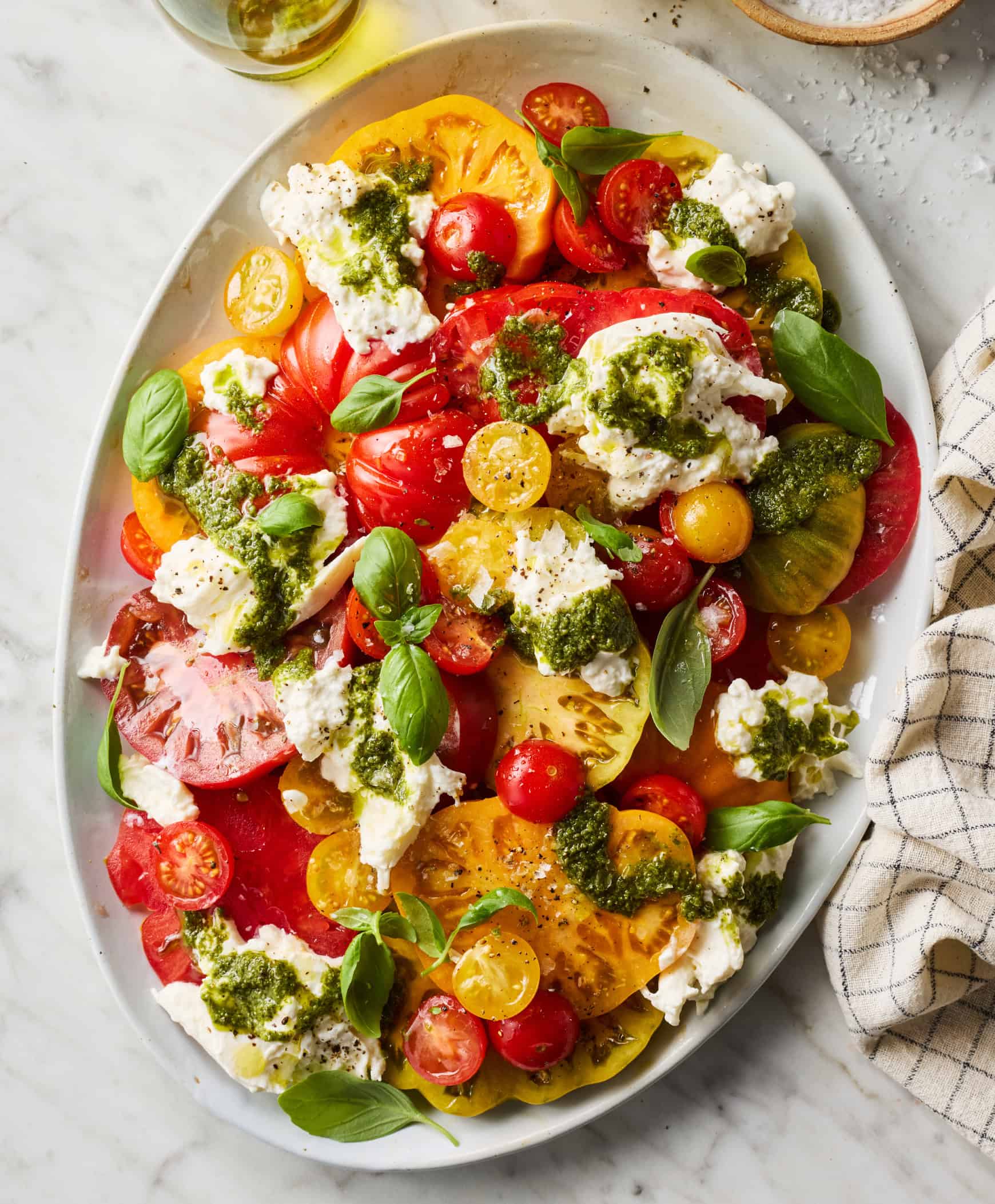 Burrata salad with tomatoes, basil, and pesto