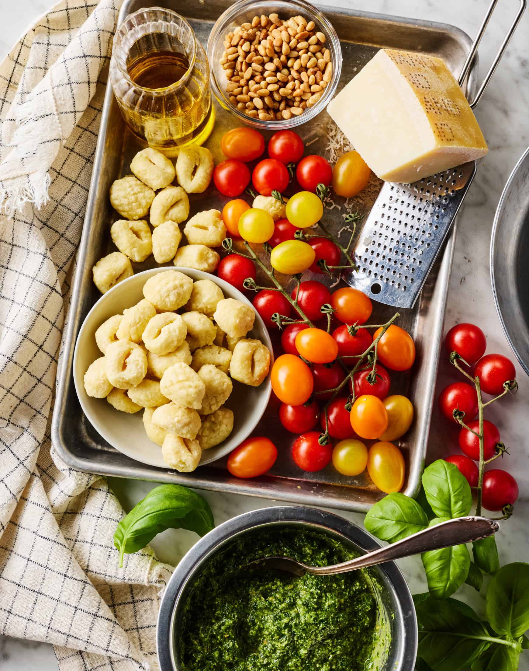 Gnocchi Caprese ingredients on baking sheet