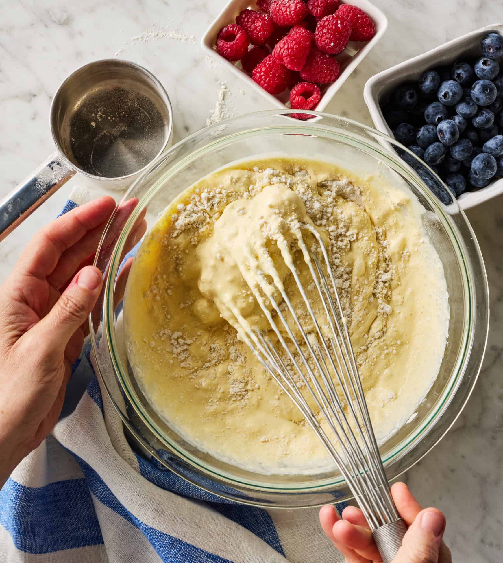 Whisking batter in glass bowl