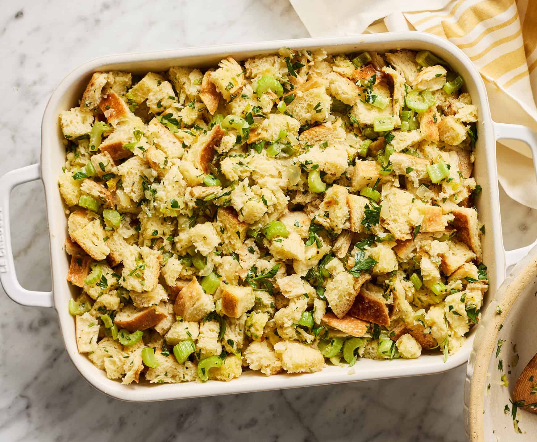 Unbaked Thanksgiving stuffing in baking dish